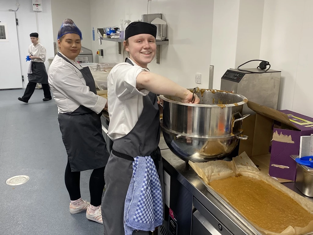 Charlotte Brown and Francesca Brass, from The Auckland Project’s Catering Team, preparing food at the charity’s Central Kitchen as part of The Auckland Project: Closed Doors, Open Hearts initiative  