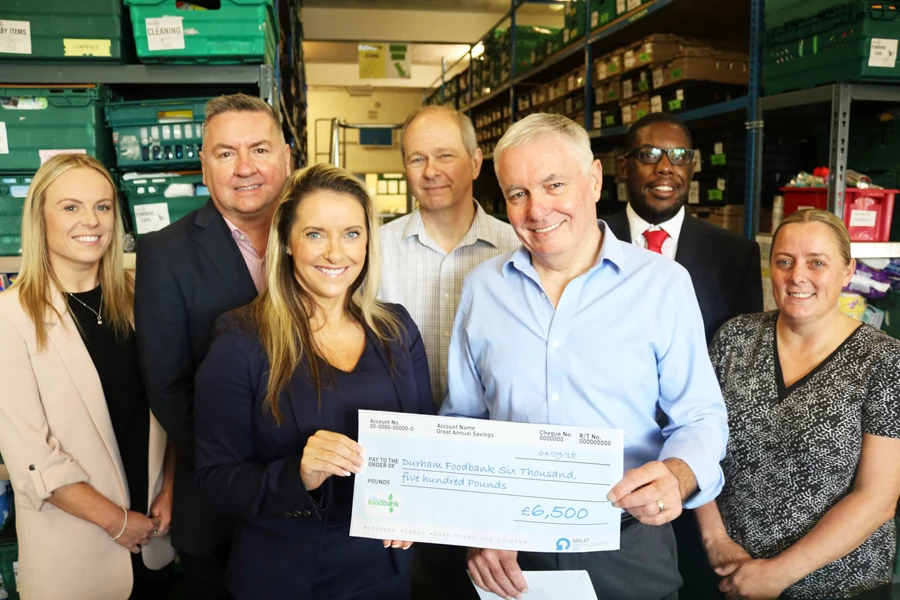 Judith Bennison, Group HR Director at GAS, hands over the annual total to County Durham Foodbank Chairman Glenn Jones