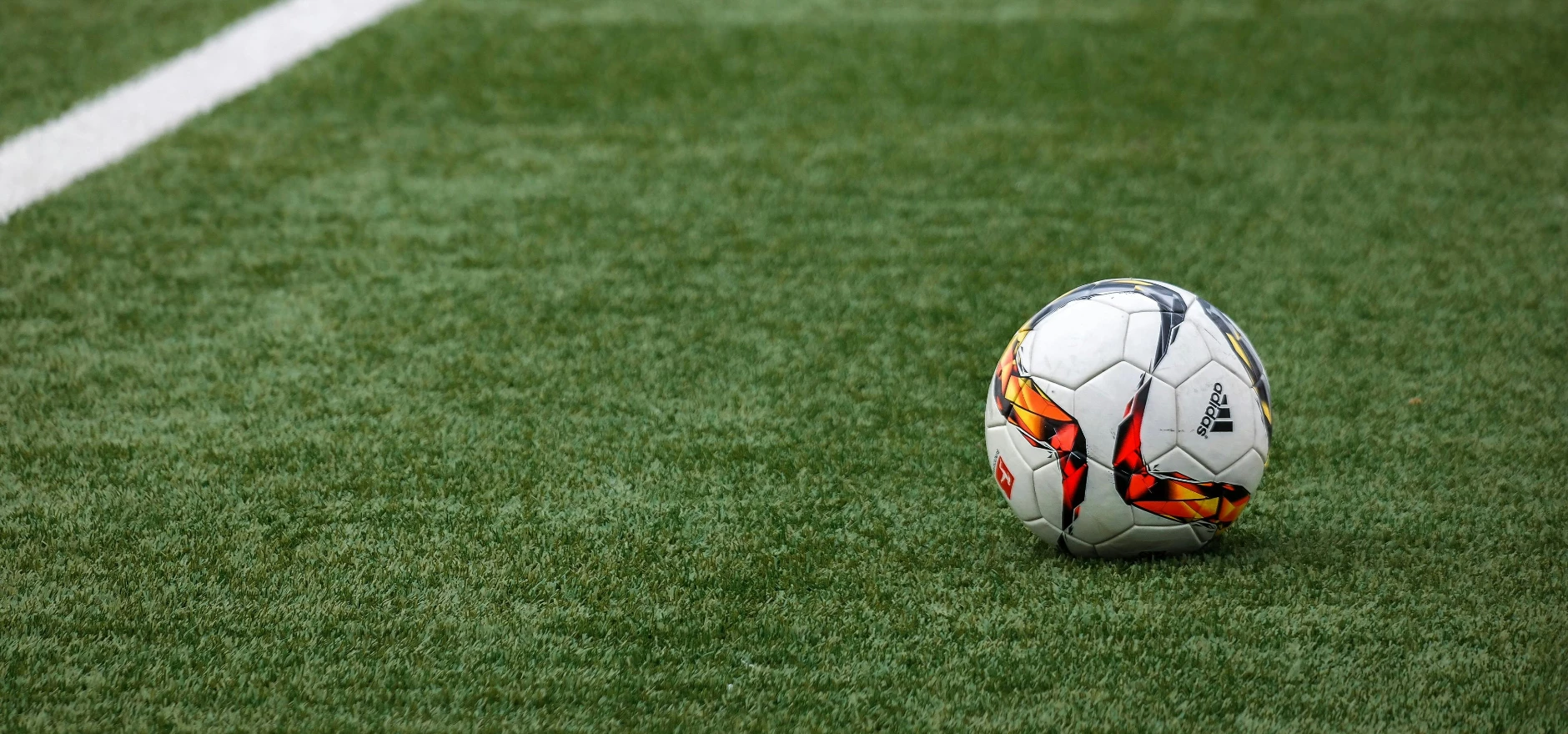 White Adidas Soccer Ball on Grass