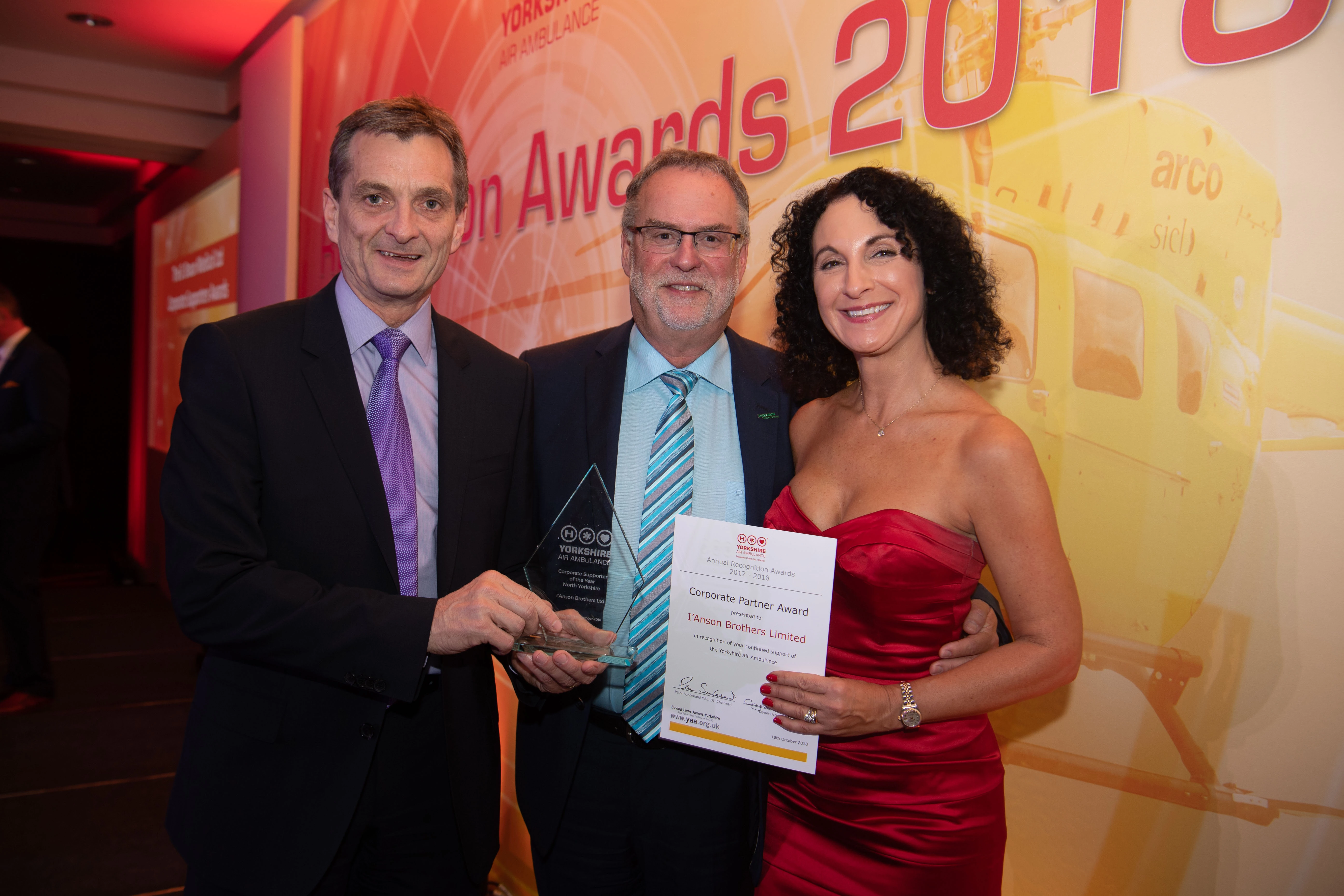 I’Anson managing director, Chris I’Anson (left) celebrates award win with his wife Kathy (right) and Hans Hux – Chairman and CEO of B Braun Ltd (the category sponsor) (middle).