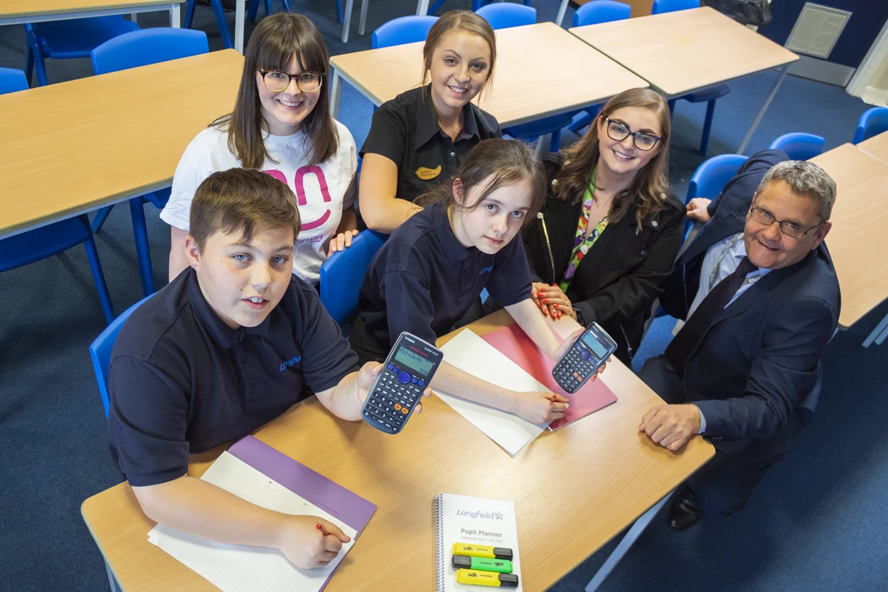 (back left to right) Esther Scott, Digital Marketing Officer at Darlington Building Society, Courtney Johnson, Nando’s, Chelsea Johnson, Darlington Cares Programme Officer, Paul Cadd, Literacy Leader, Longfield Academy with pupils of Longfield Academy