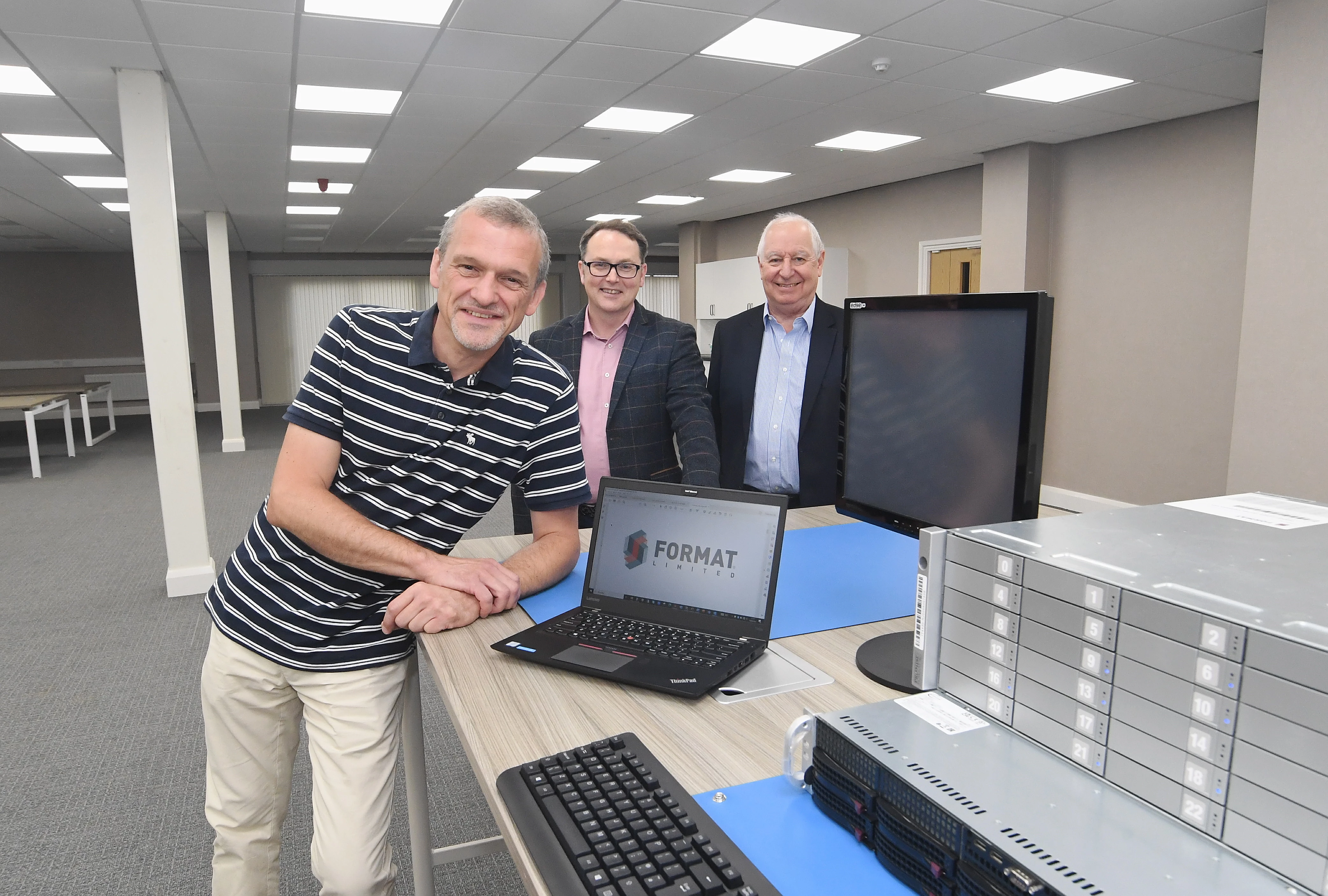 From left: Piotr Sobstyl, Mark Tock, and Martin Williams inside Format Ltd’s new office at the Vanguard Centre