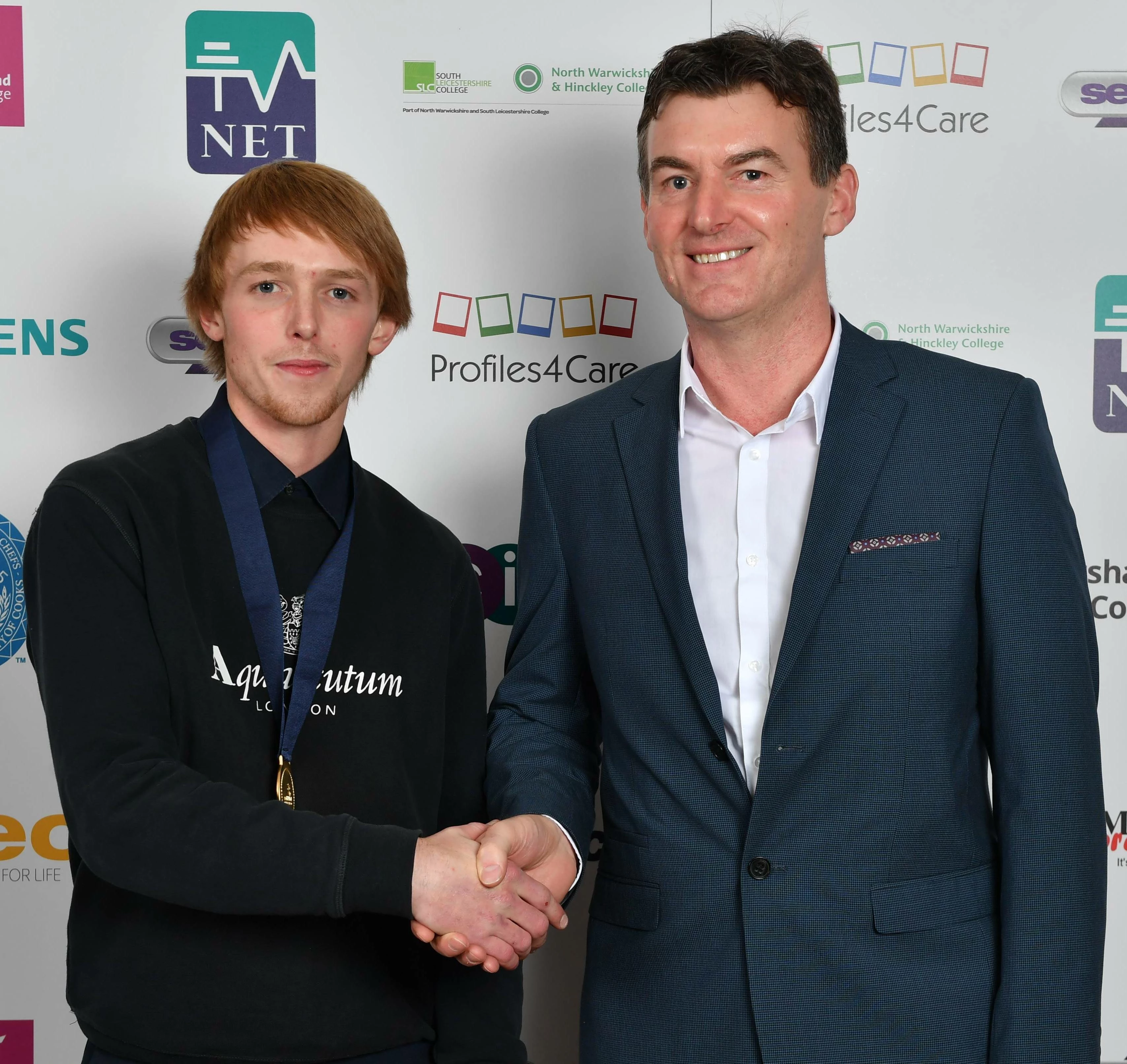 Oliver Farrell, CITB SkillBuild Product Manager, and gold medal winner Harry Pennock from Leeds. 