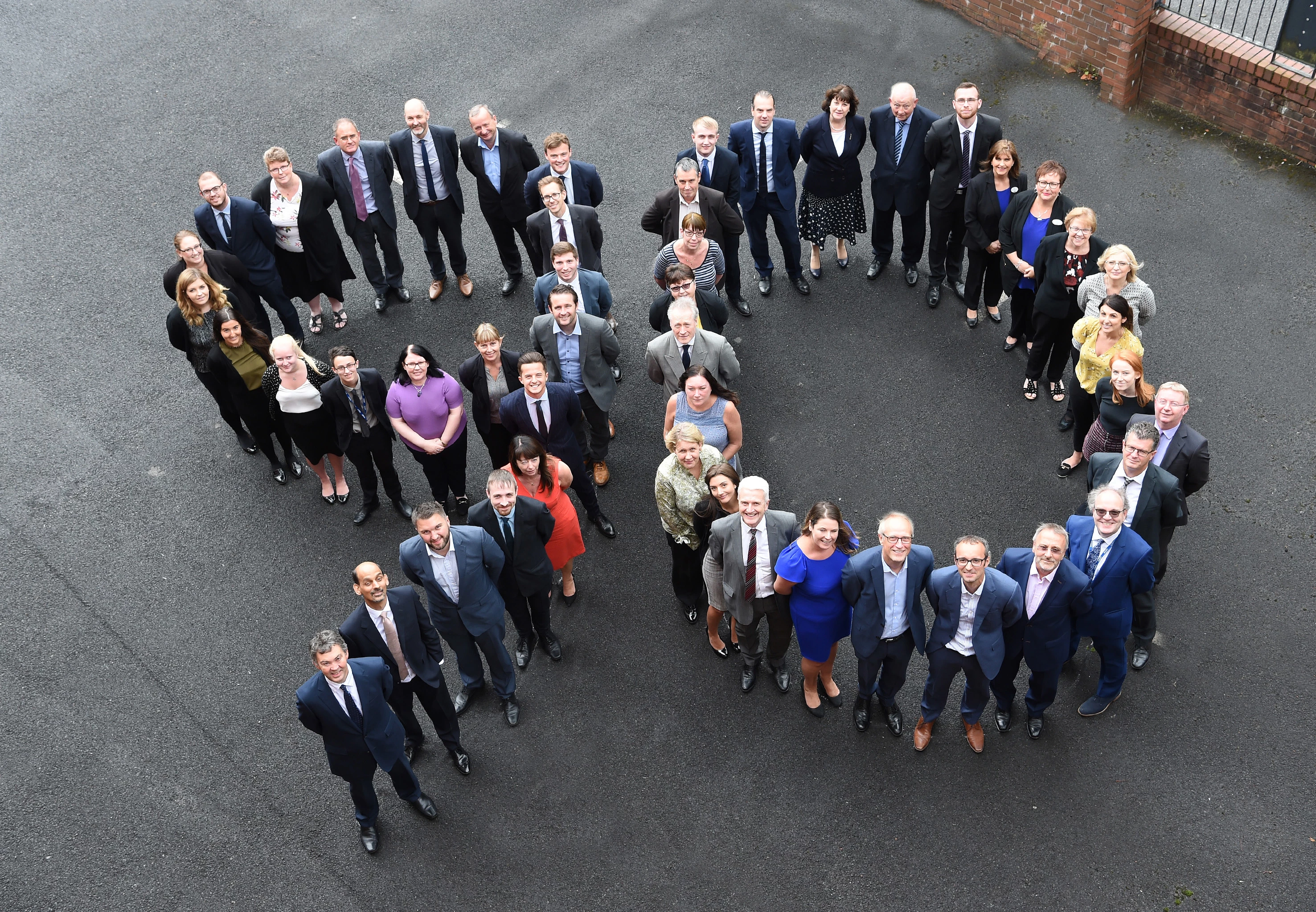 The team at Pierce celebrate 90 years of the business