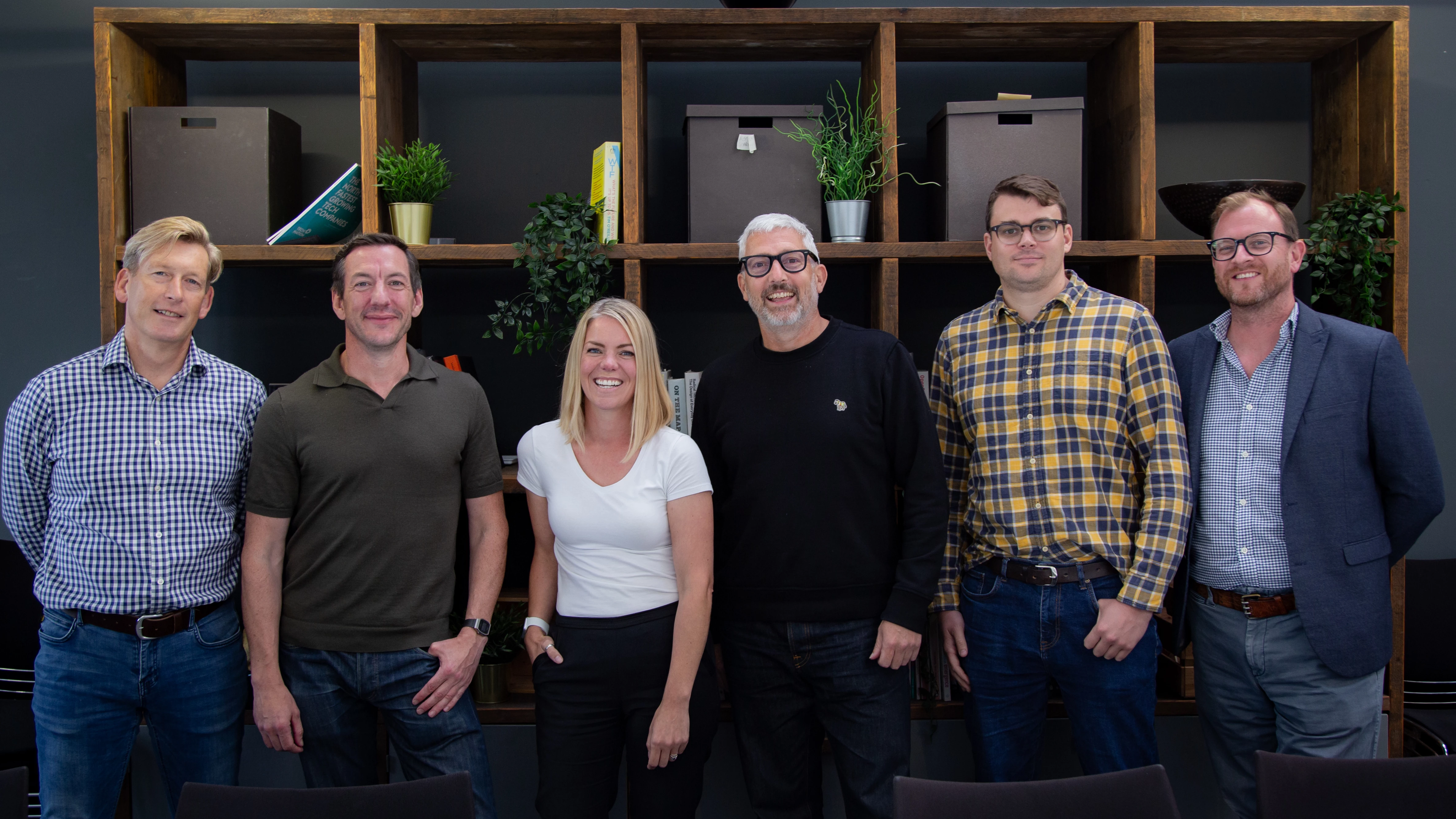 The Data City board standing in a row in their Leeds offices.
