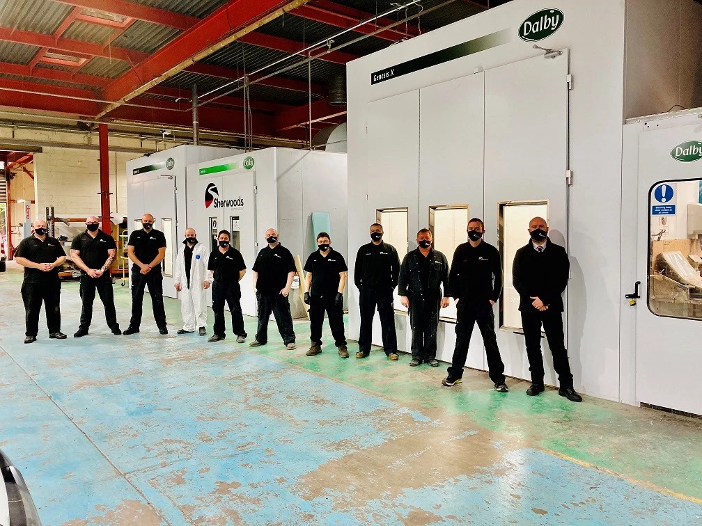 Sherwoods' bodyshop manager Marc Madden, right, with his team in front of the new spray booths