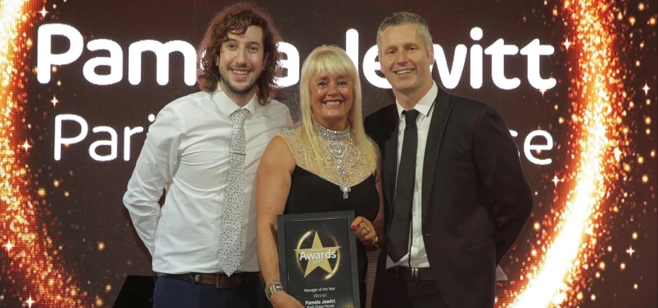Pamela Jewitt, from Paris Dress House, receiving the award for intu Metrocentre Manager of the Year from general manager Gavin Prior (right) and Bodg Howard from Capital FM.