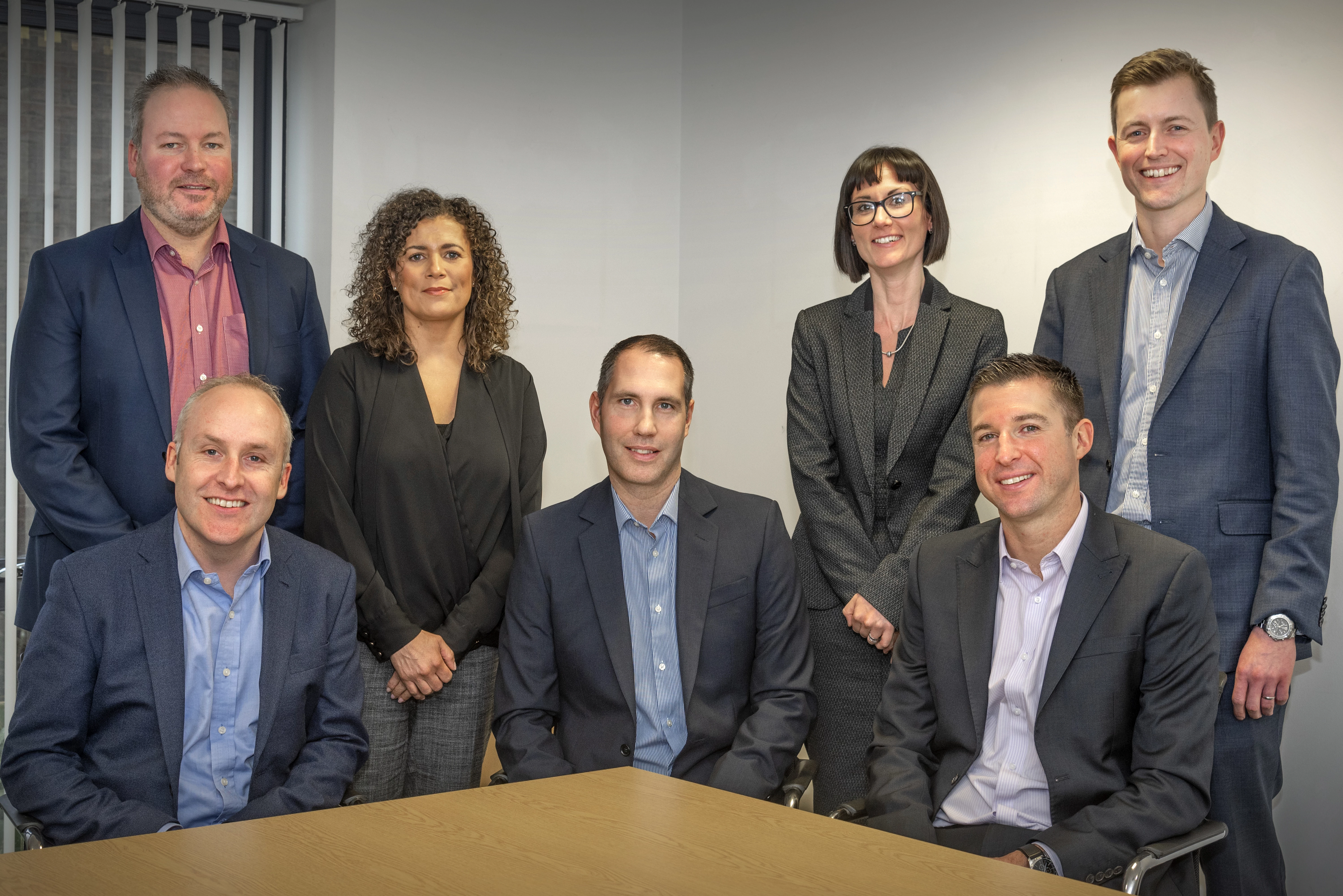 The delighted Identity Consult board - (seated, from left), Matty Pendergast, Mark Doherty, Pete Johnson; (standing), Mark Williams, Michelle Merry, Alex Atkinson, Andrew Milnes.