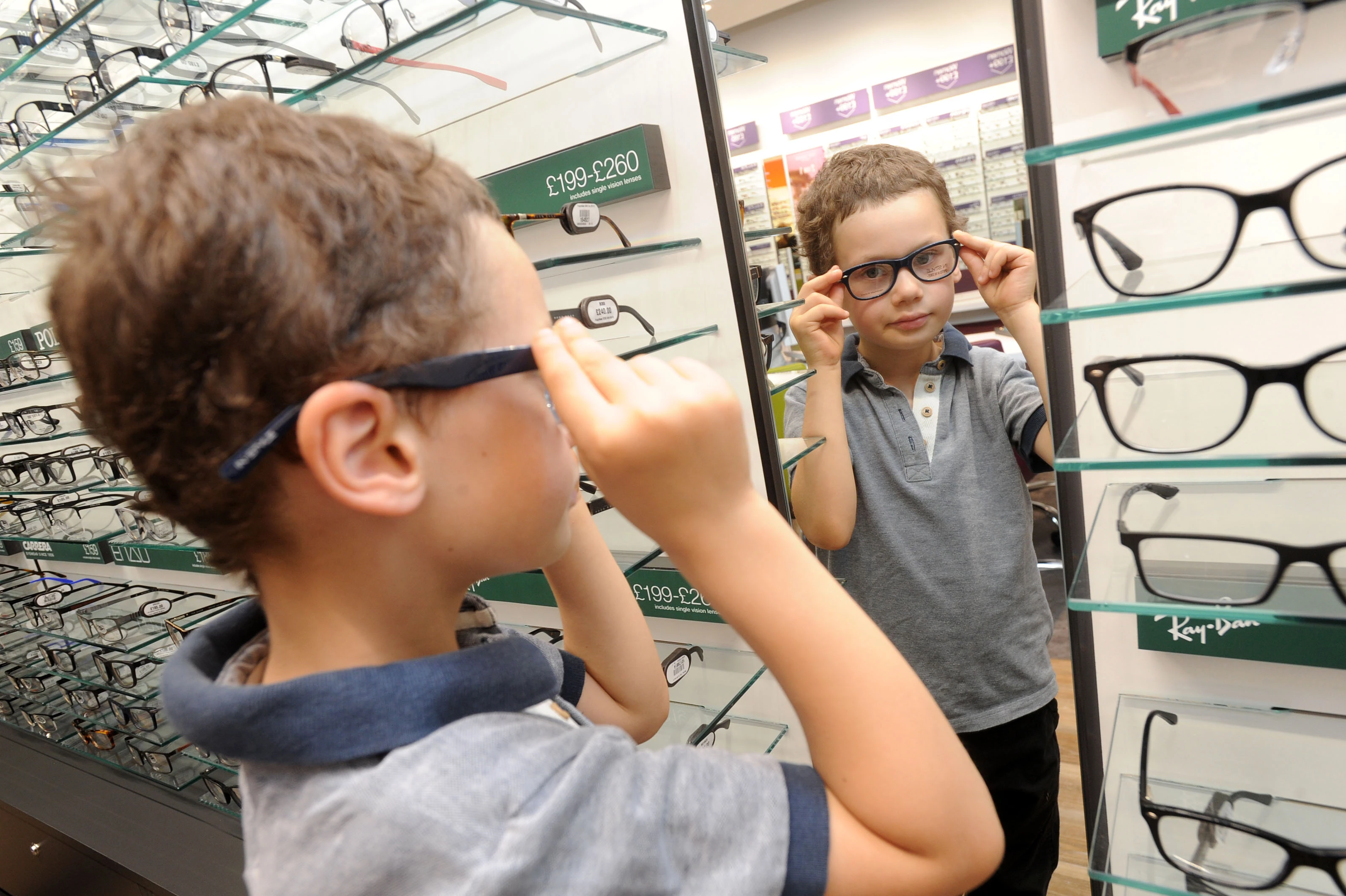 Antonio Constantine tries on frames at Vision Express Kingston