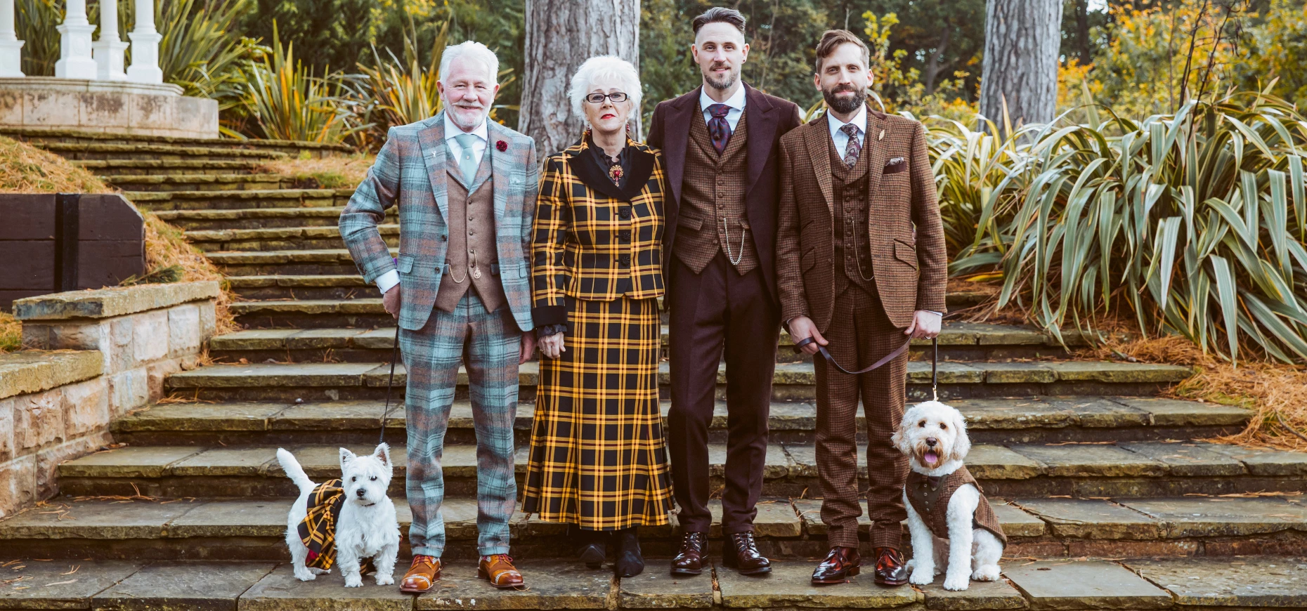 Founders Derrick Langley and Nicholas Harvey-James, along with their partners and dogs, all dressed in Dandy Threads attire.