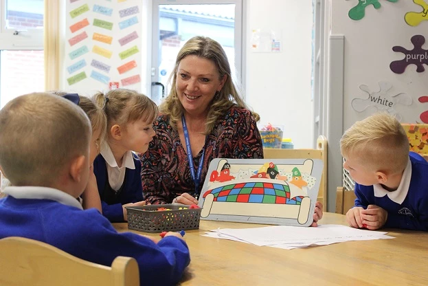Deputy Headteacher at Southwick Community Primary School with pupils