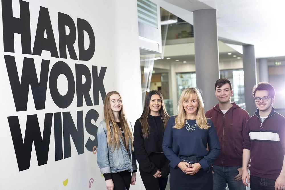 Judith Doyle CBE, principal and chief executive of Gateshead College (centre), with students at the college