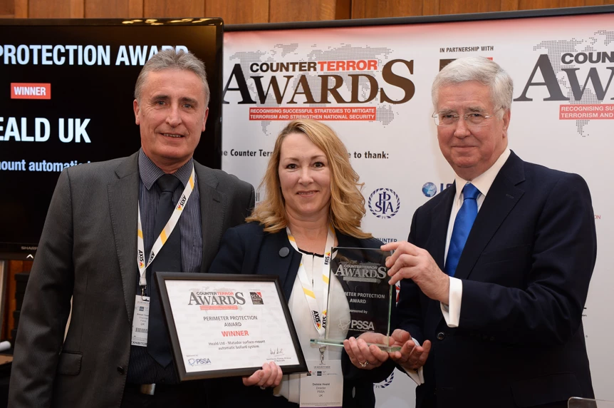 Debbie Heald MBE (centre) with Rt. Hon Sir Michael Fallon (right) and Simon Towers, Chairman of the PSSA (left)