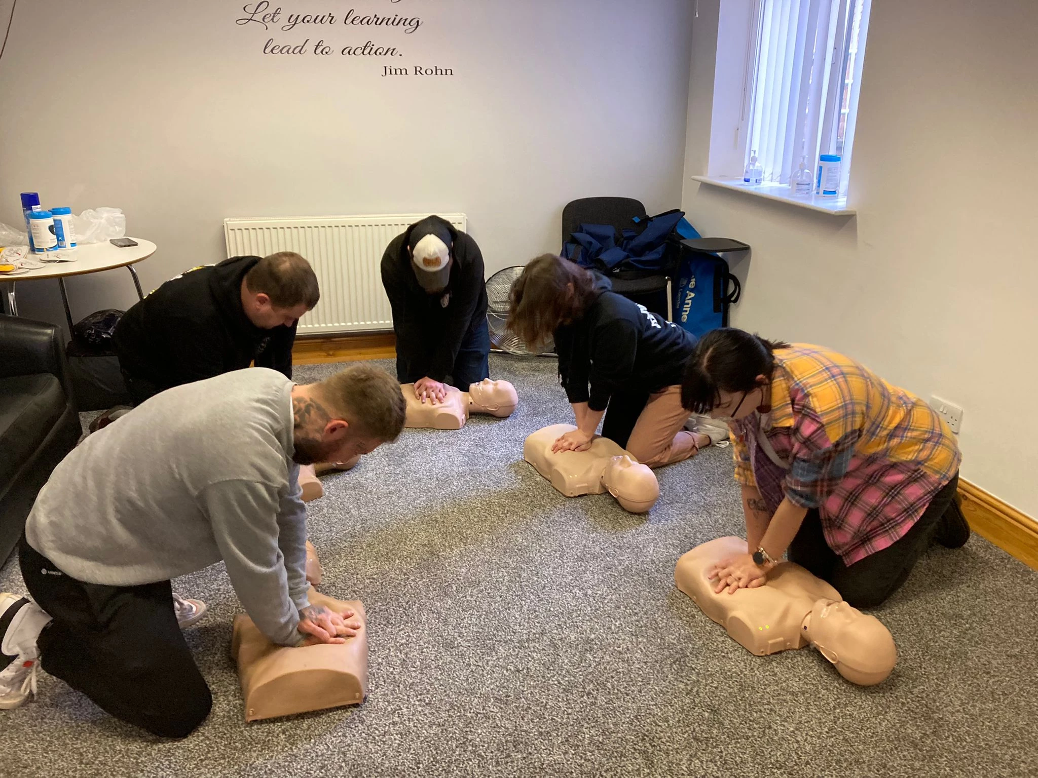 Some of the trainees learning how to carry out CPR on the BID-sponsored Emergency First Aid at Work course