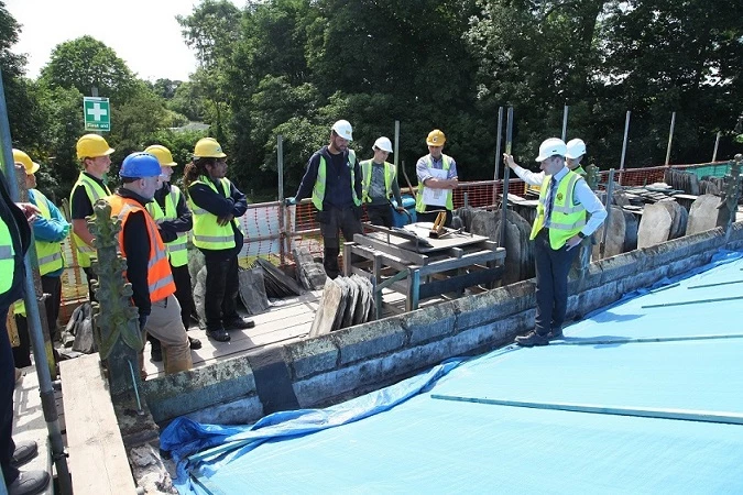 Martin-Brooks director, Nick Brooks (far right), shows visitors the roof at Holy Trinity Church in Messingham as part of its skills day. 