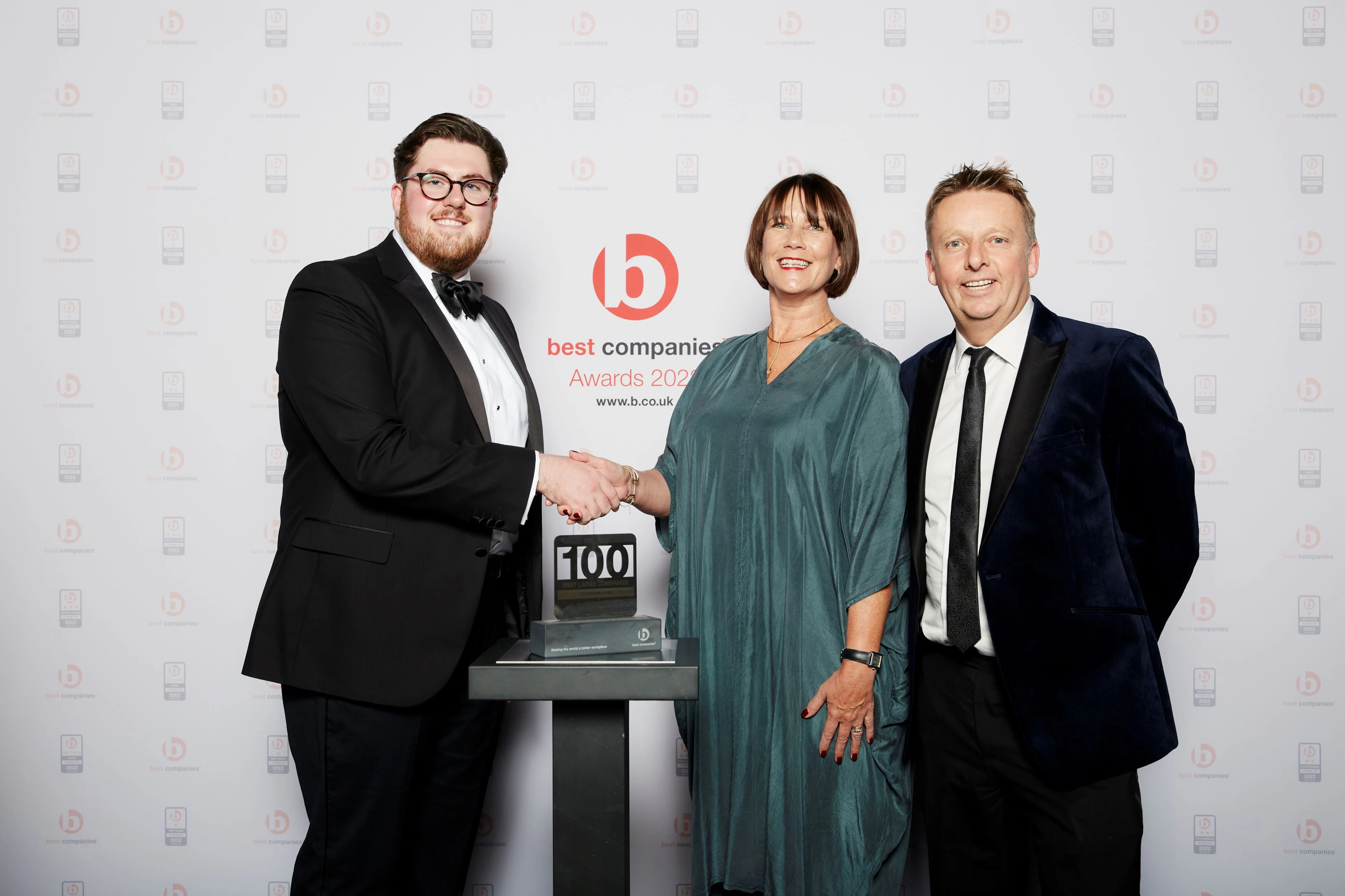 Helen Saunders and Roger Hutton (right) of Clarion being presented with the firm’s three star award in the prestigious ‘UK’s 100 Best Companies to Work For’