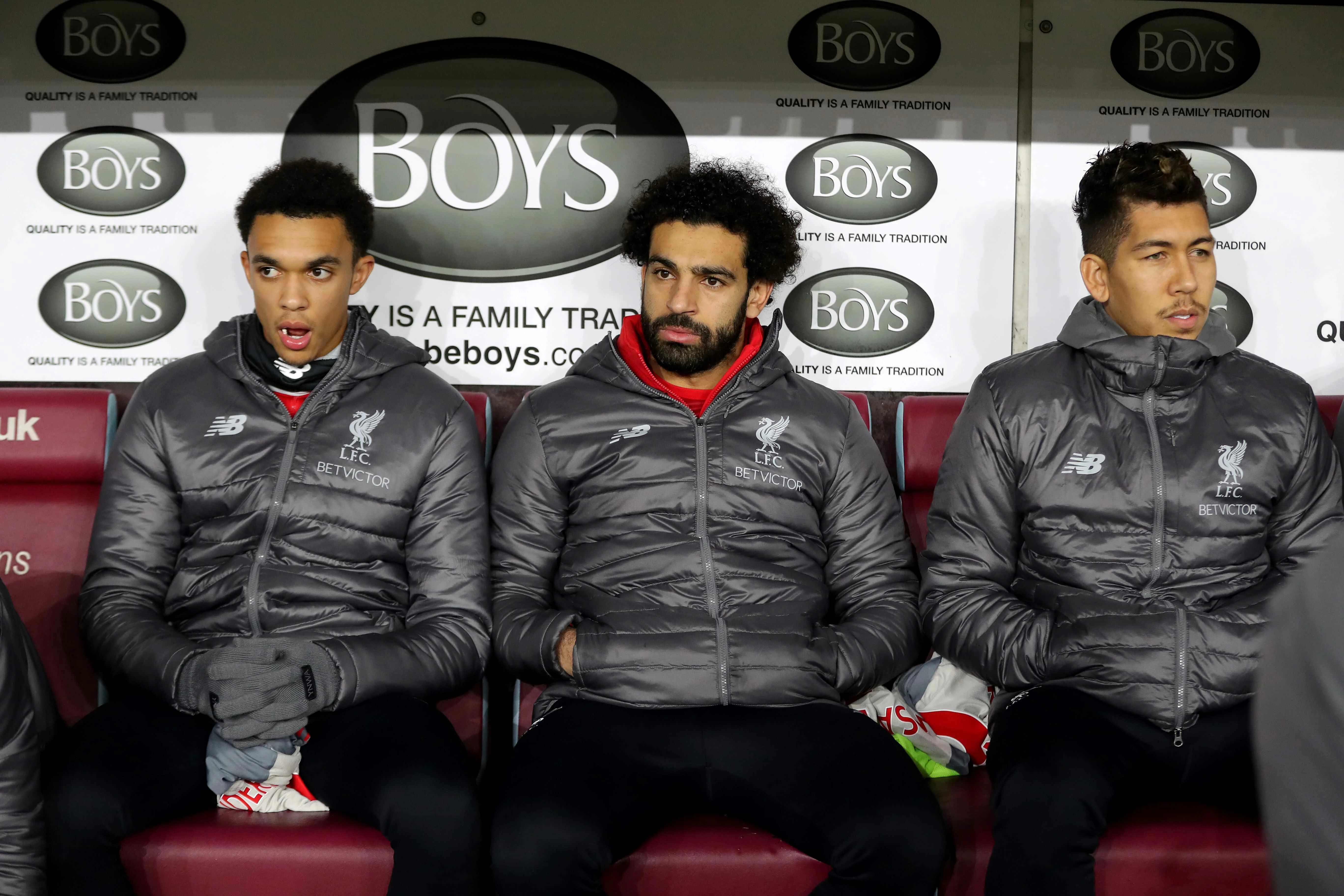 Trent Alexander-Arnold, Mo Salah and Roberto Firmino of Liverpool on the Burnley away bench
