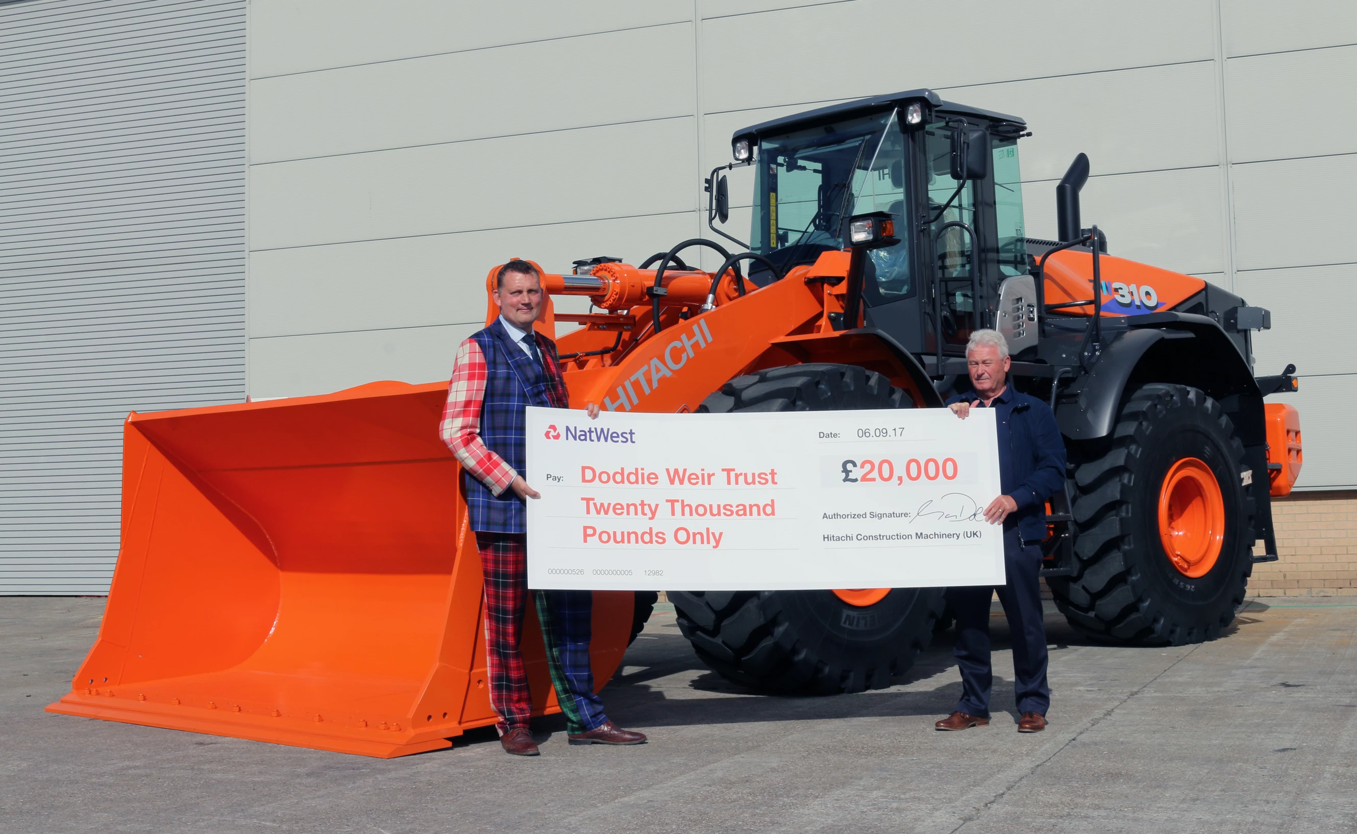 Doddie Weir Receives Cheque From Hitachi Construction Machinery