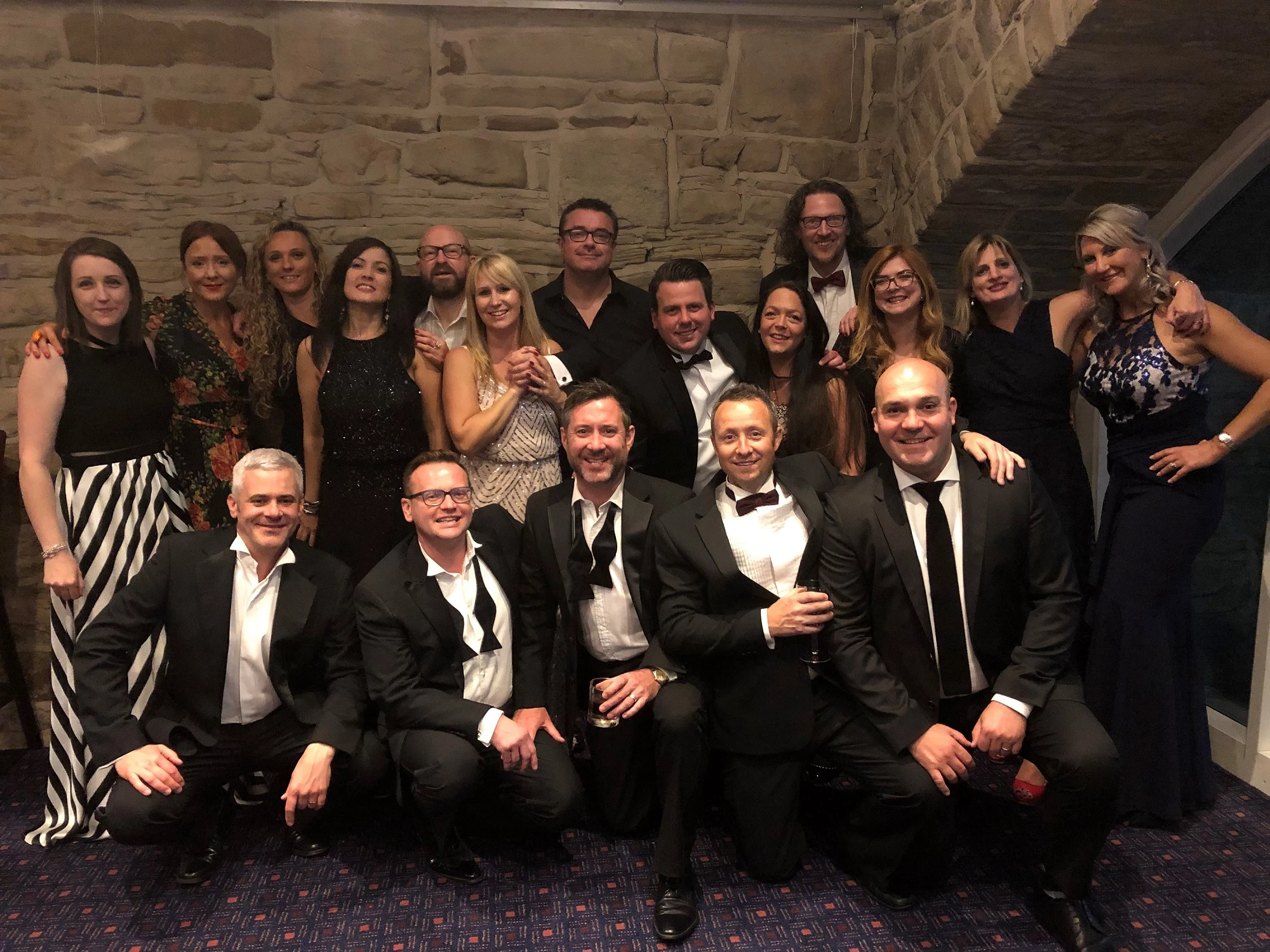Belmayne partner, Ben Smalley (front row, second left) and guests at the firm's charity ball. 