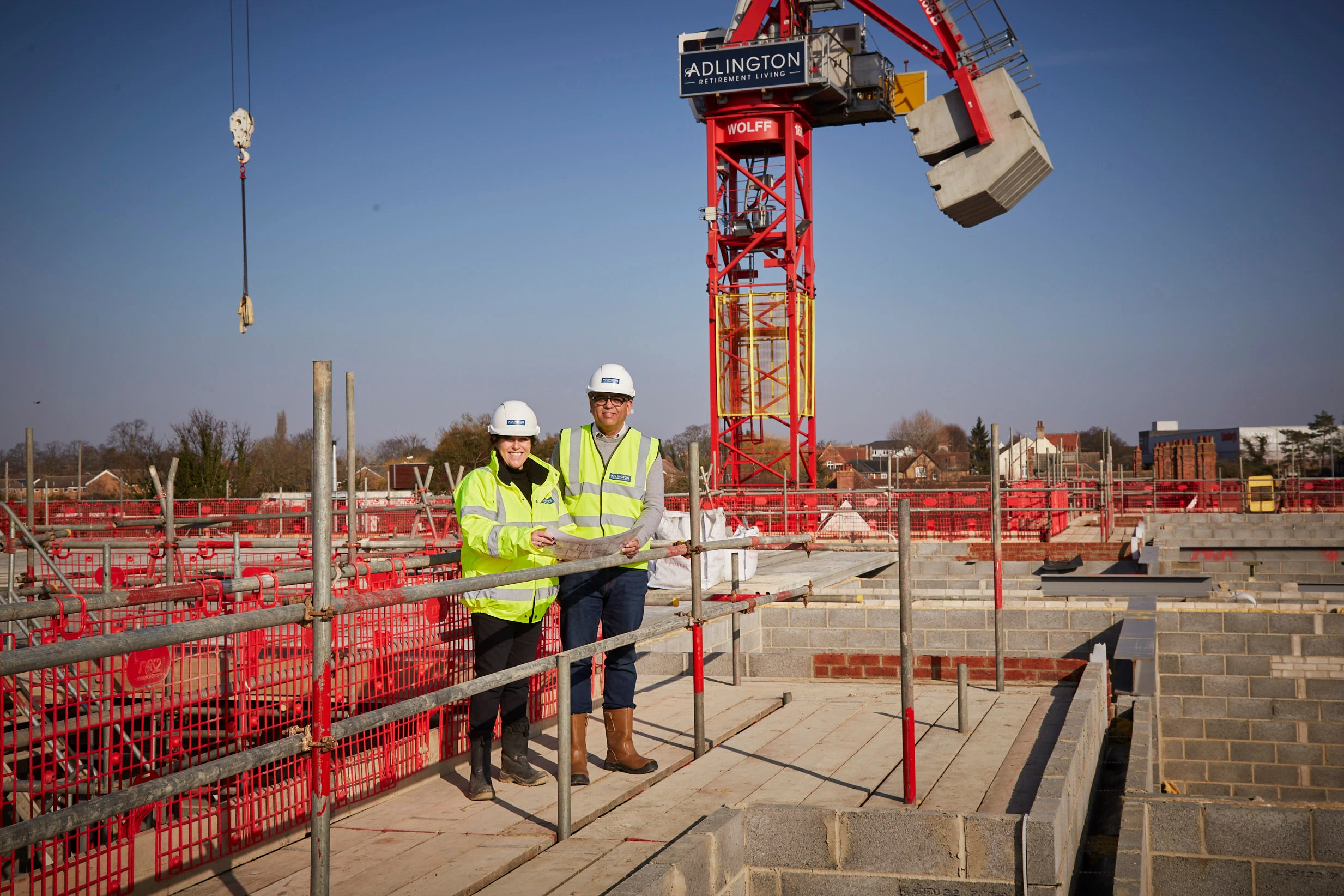 Alexandra Johnson and Mohammad Yasin MP at the construction site for The Newells, a brand-new retirement community in Kempston, Bedfordshire