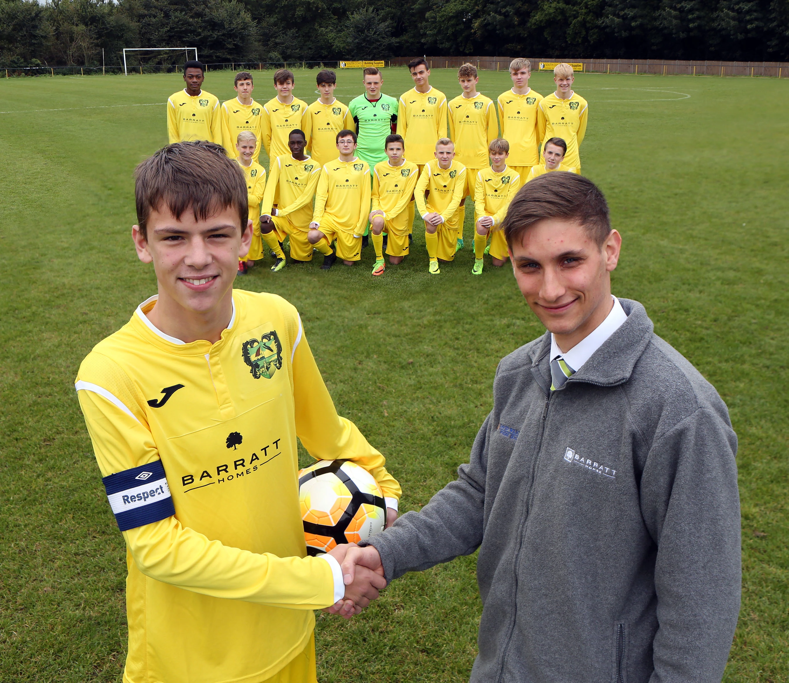 Barratt Homes apprentice Ben Leahy presents the Hamble Colts with their new kit.