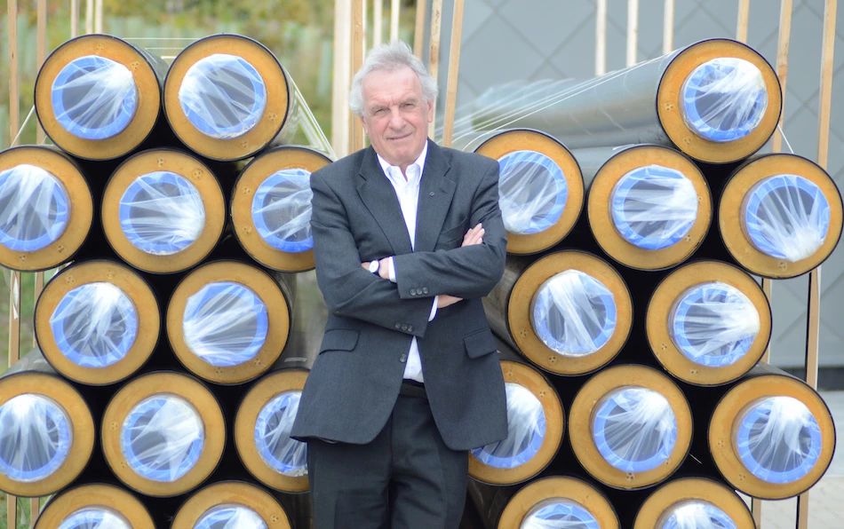 Councillor John McElroy with the plastic district heating pipes