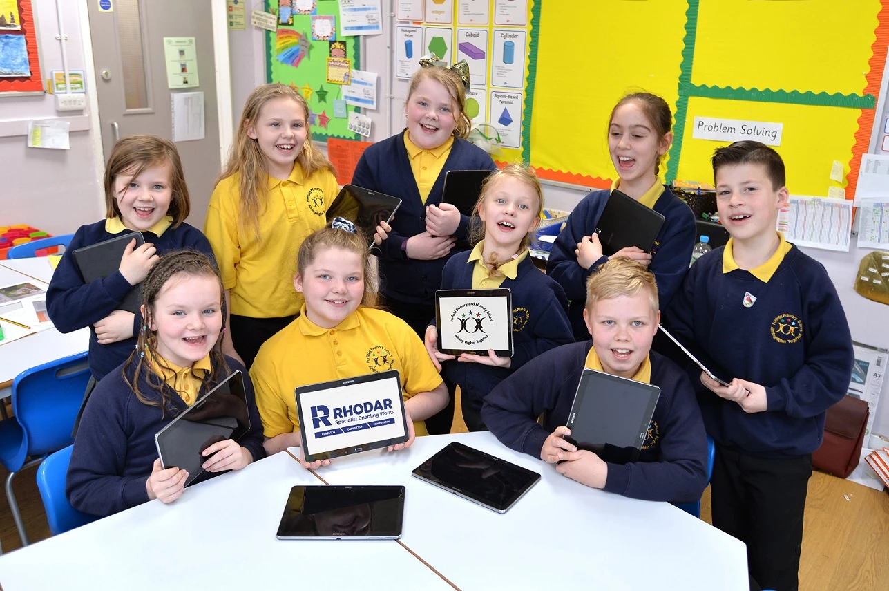 The children of Farfield Primary School with their new tablets
