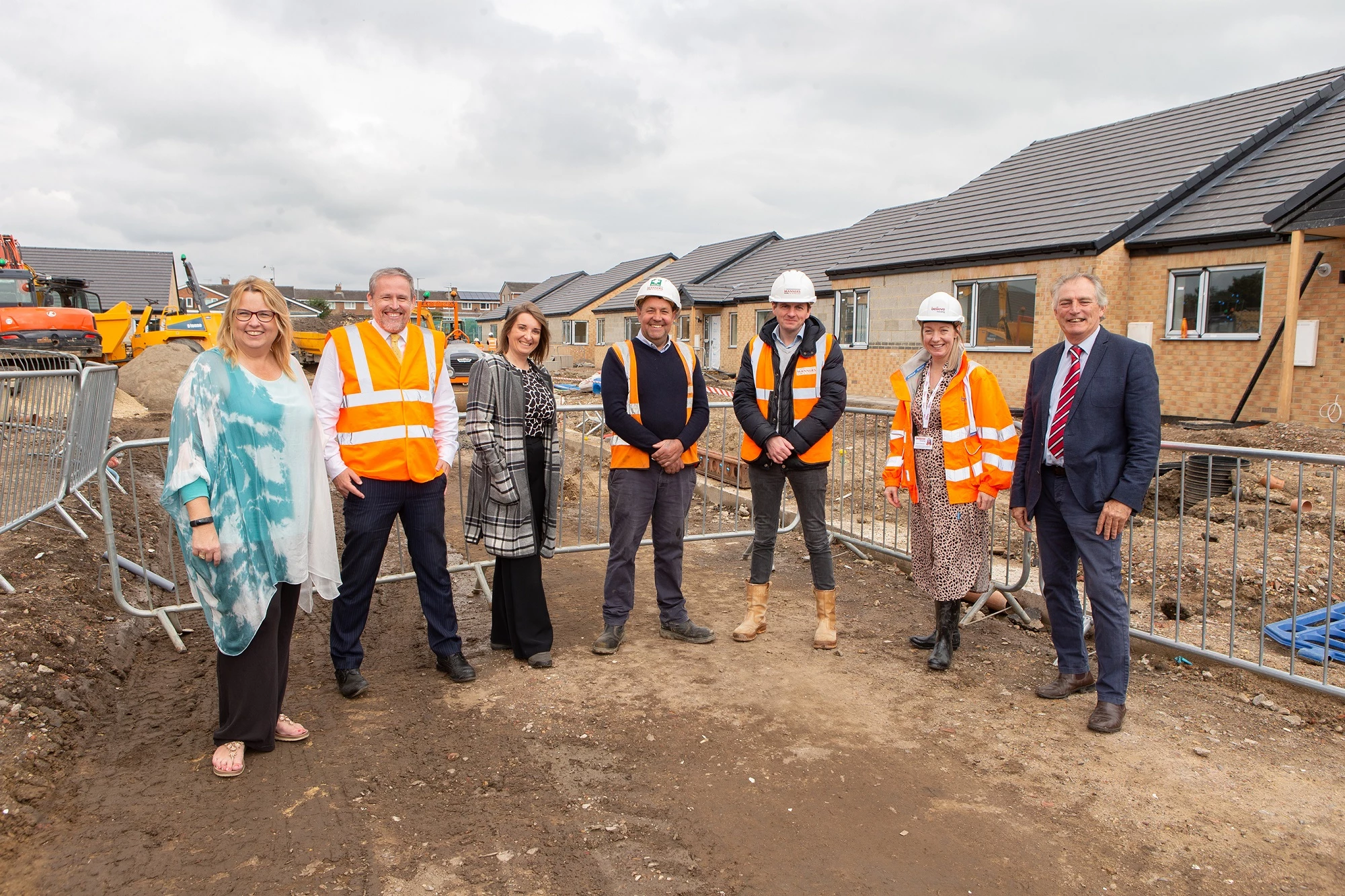 Local officials and site managers at the St Godric’s housing development in Newton Hall.