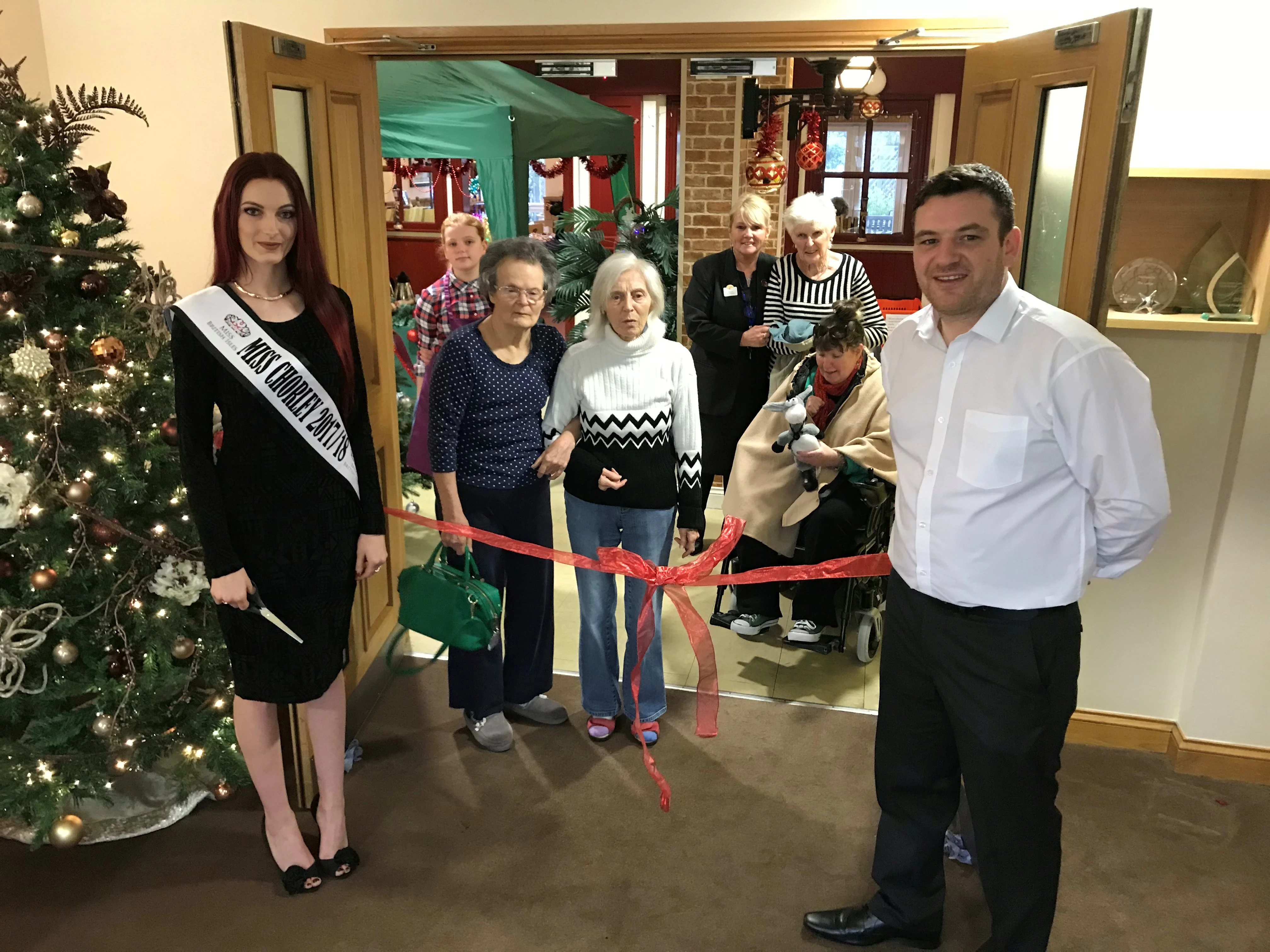 Miss Chorley opening the market, alongside residents, staff, members of the public and Market Square coordinator Chris Durnan 