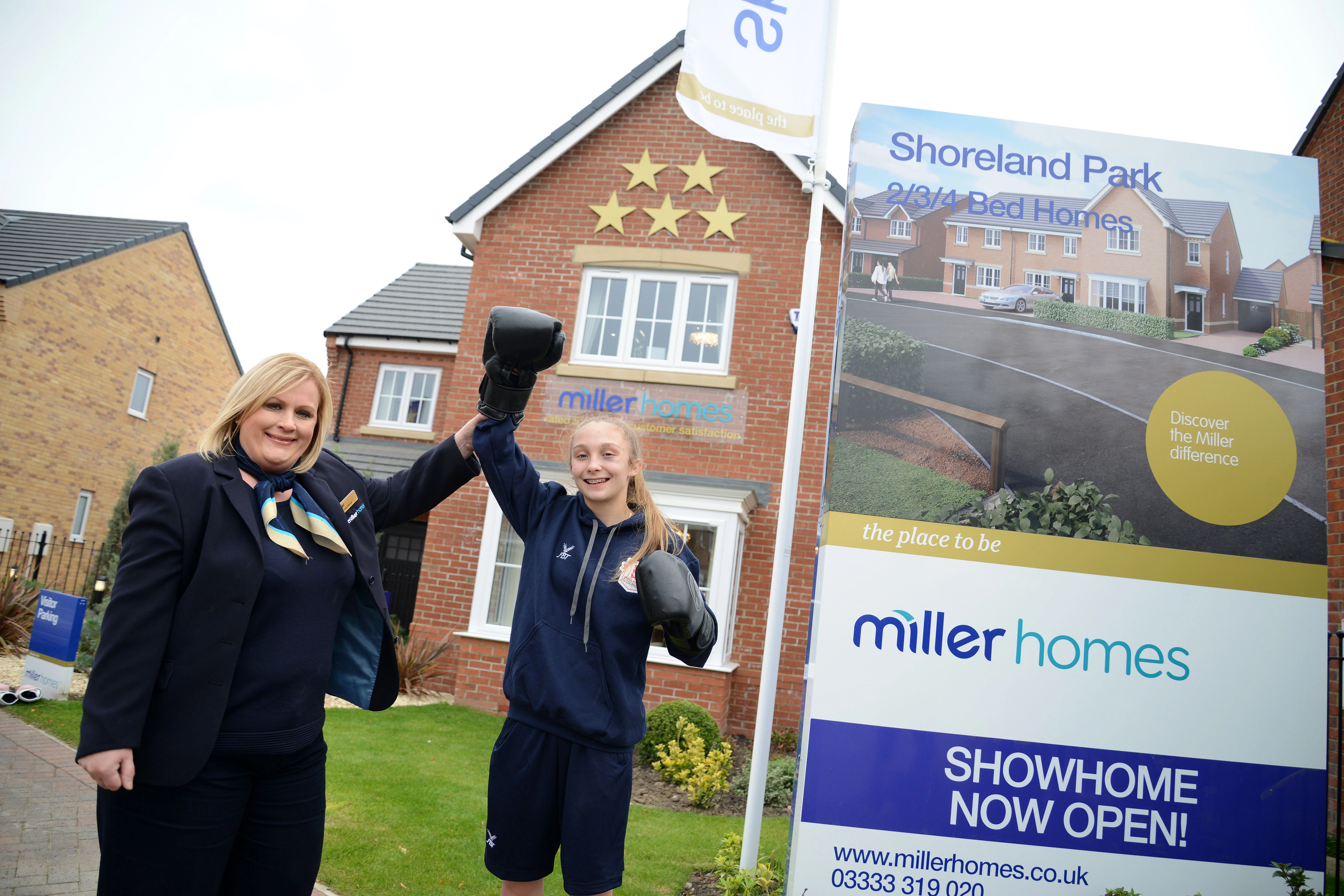 Miller Homes development sales manager Lyndsey Murray and boxer Alex Brown