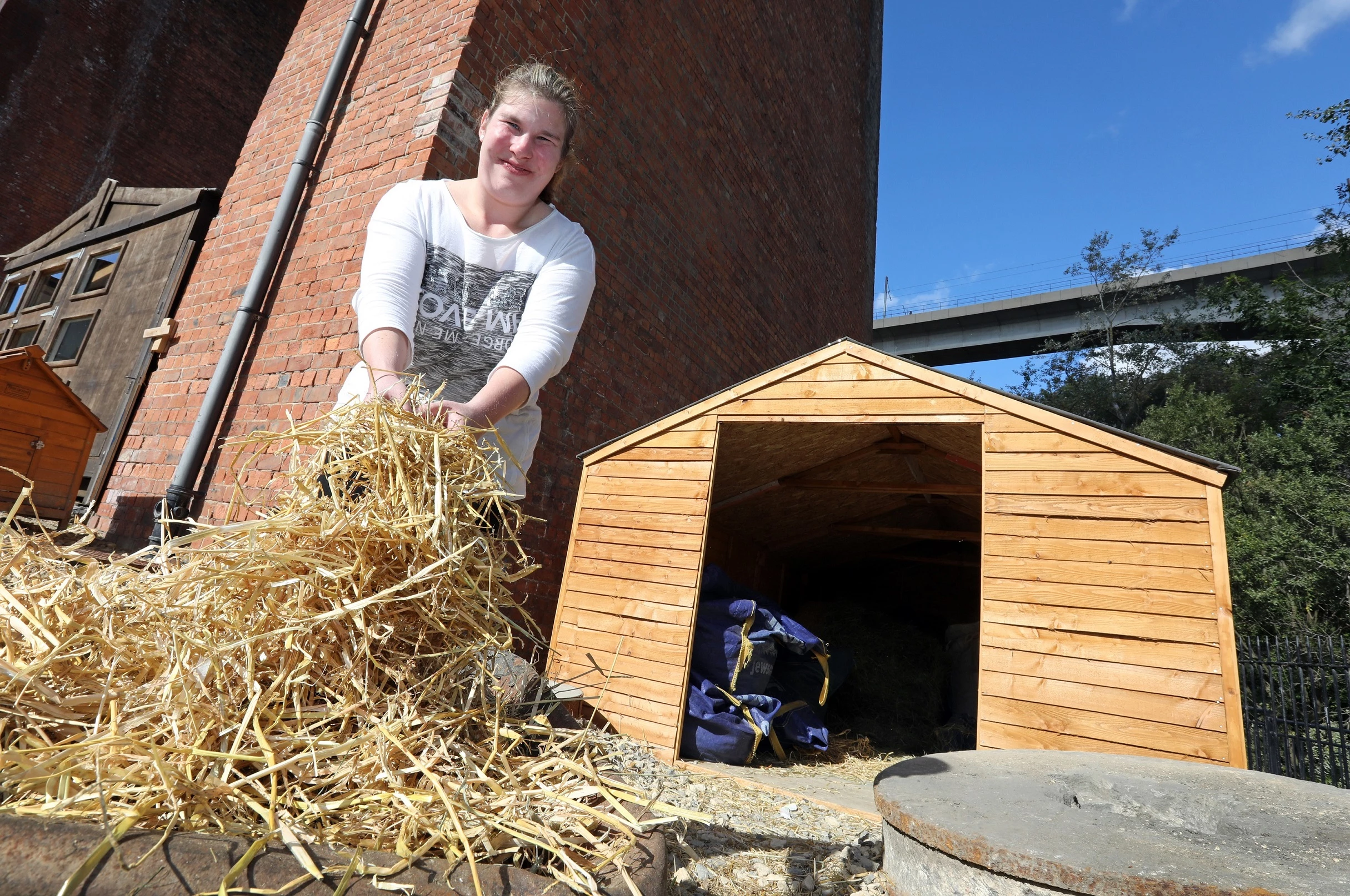 Ouseburn Farm volunteer, Amy outside of the new fodder store which has just been installed at Ouseburn Farm