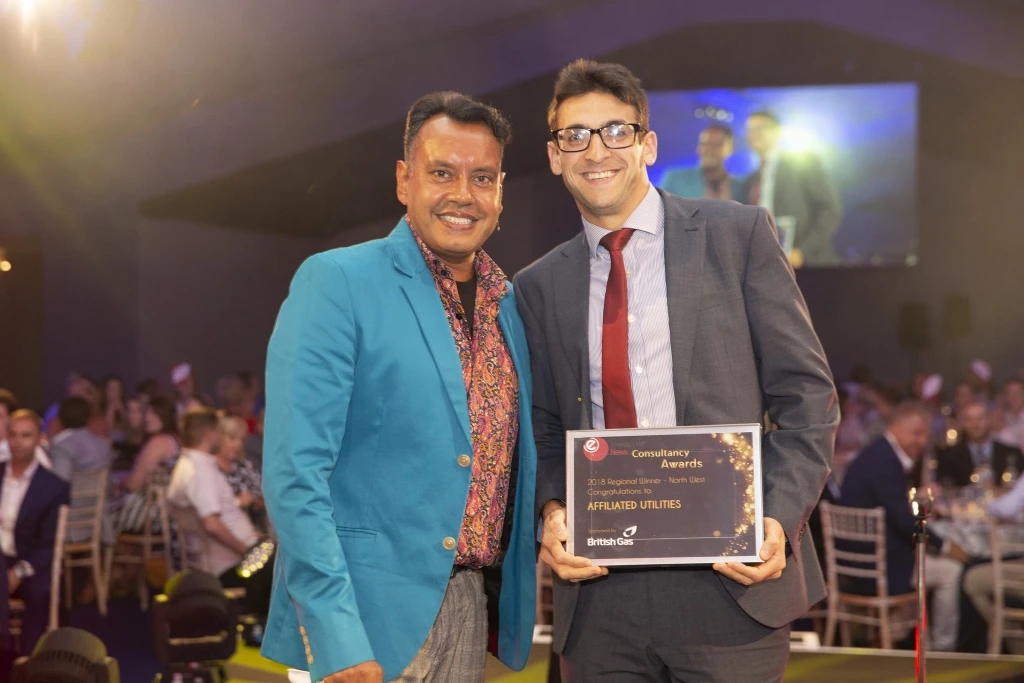 Senior energy consultant Jonny Finlay of Affiliated Utilities receives the award from Sumit Bose, editor of Energy Live News.