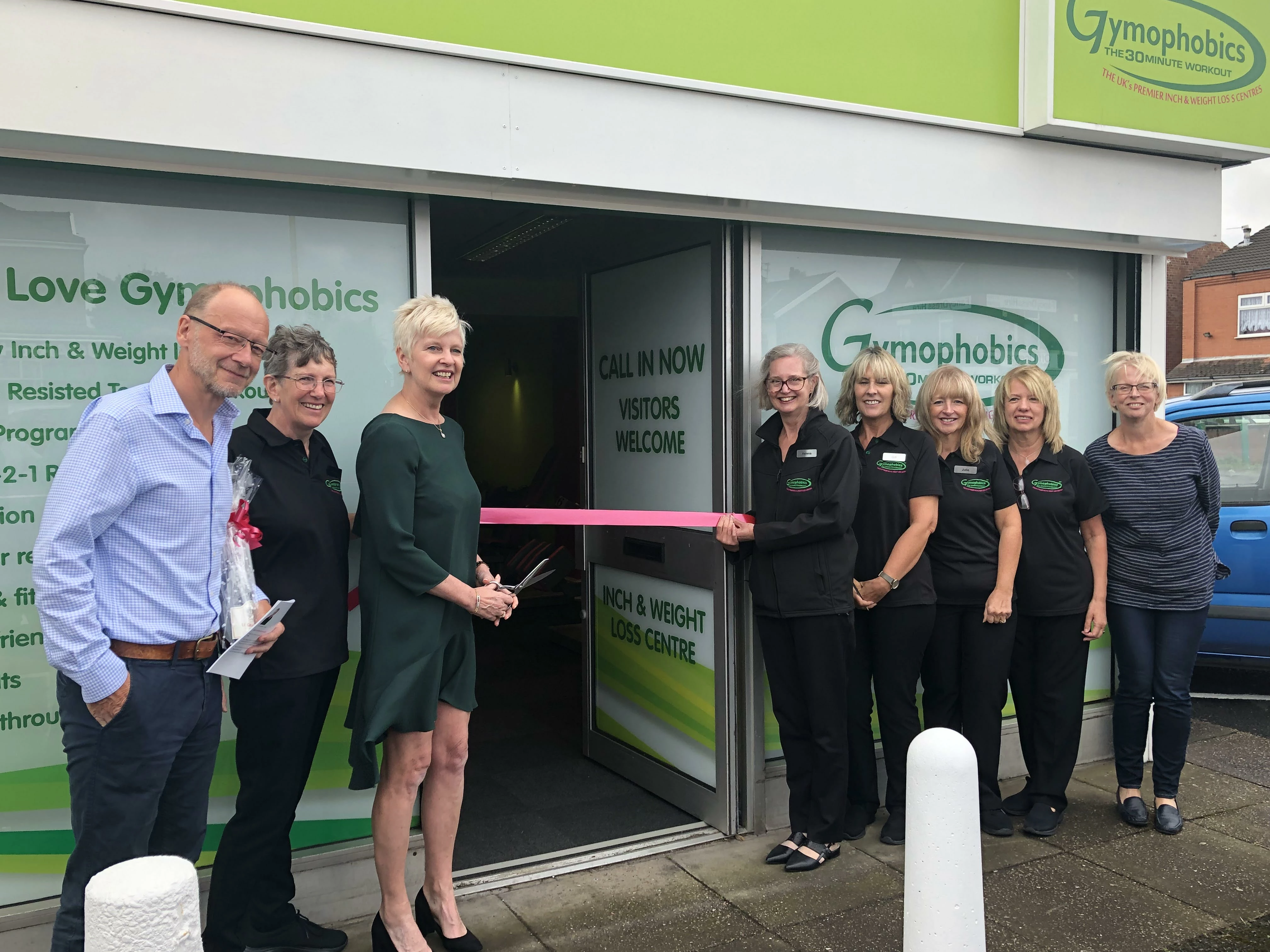 The ribbon cut by Gymophobics founder Donna Hubbard, with help of left to right Dr David Unwin, new co-owners Anne Molyneux and Helena Knapton, the gym instructors and Dr Jen Unwin (far right).