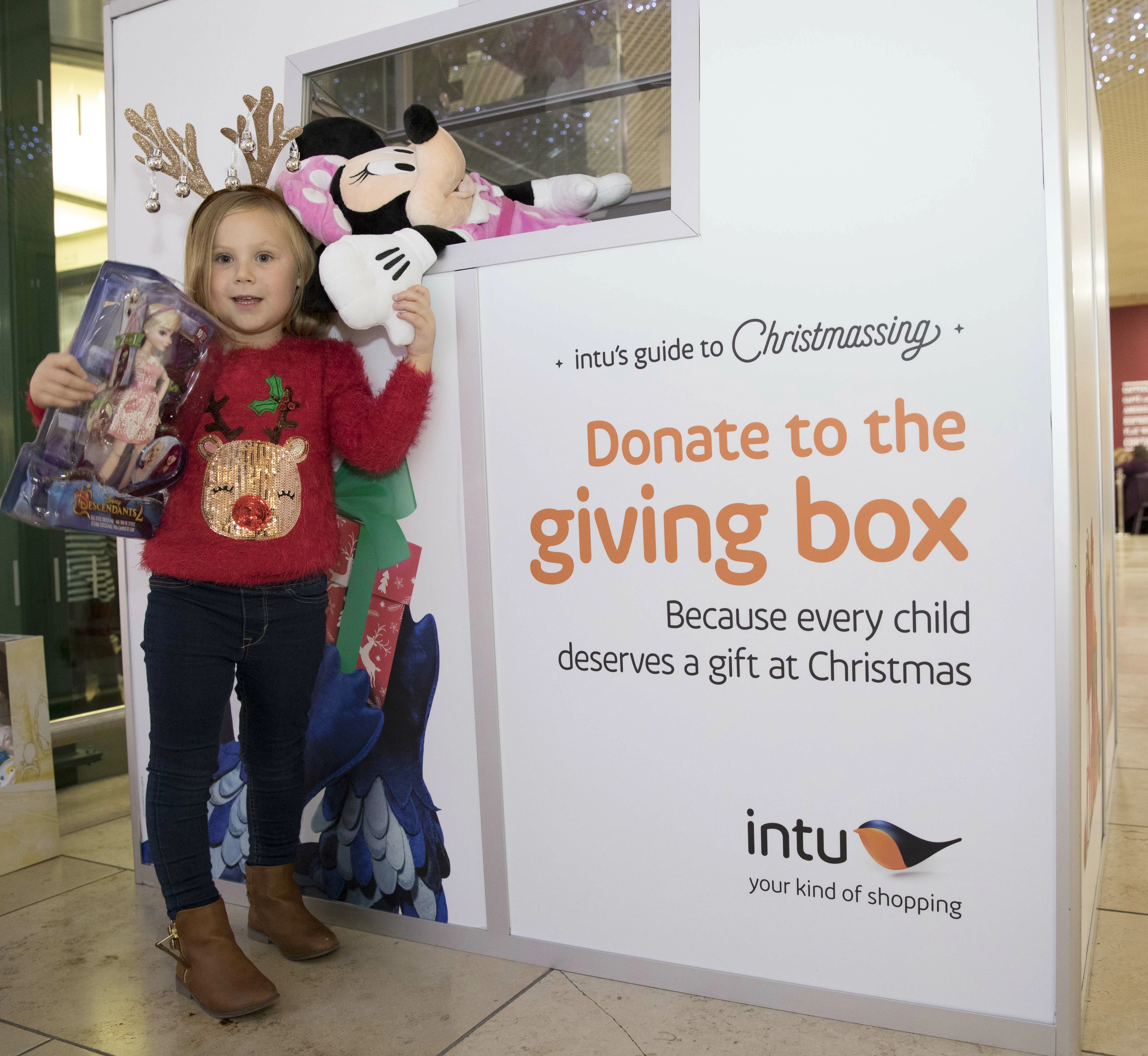 Anya Giblin, 4, from Stocksfield with donations to the Giving Box