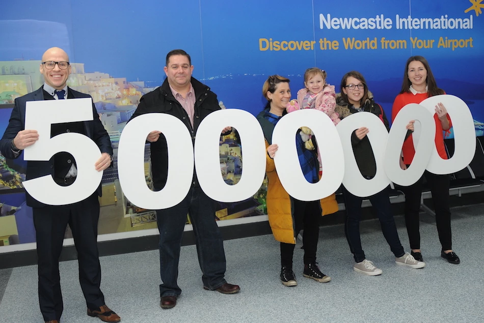 Leon McQuaid, Aviation Development Manager at Newcastle International Airport and five millionth passengers, Mark Knight.