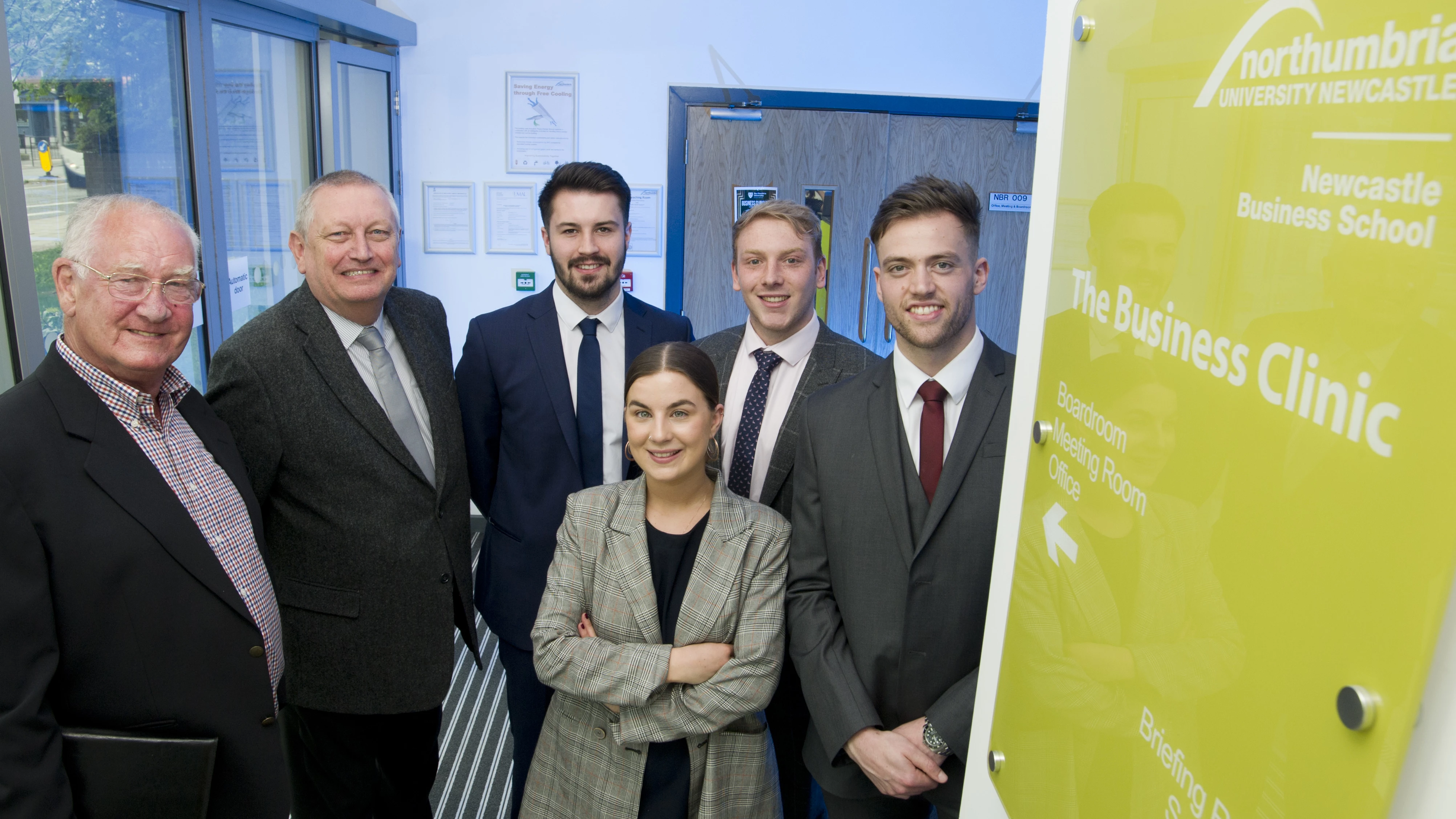 (L to R) George Williams and Ken Brown, chair of Morpeth & District Chamber of Trade with Business Clinic students William Barnes, Oliver Duxbury, Joshua Boland and Rose Stocks.