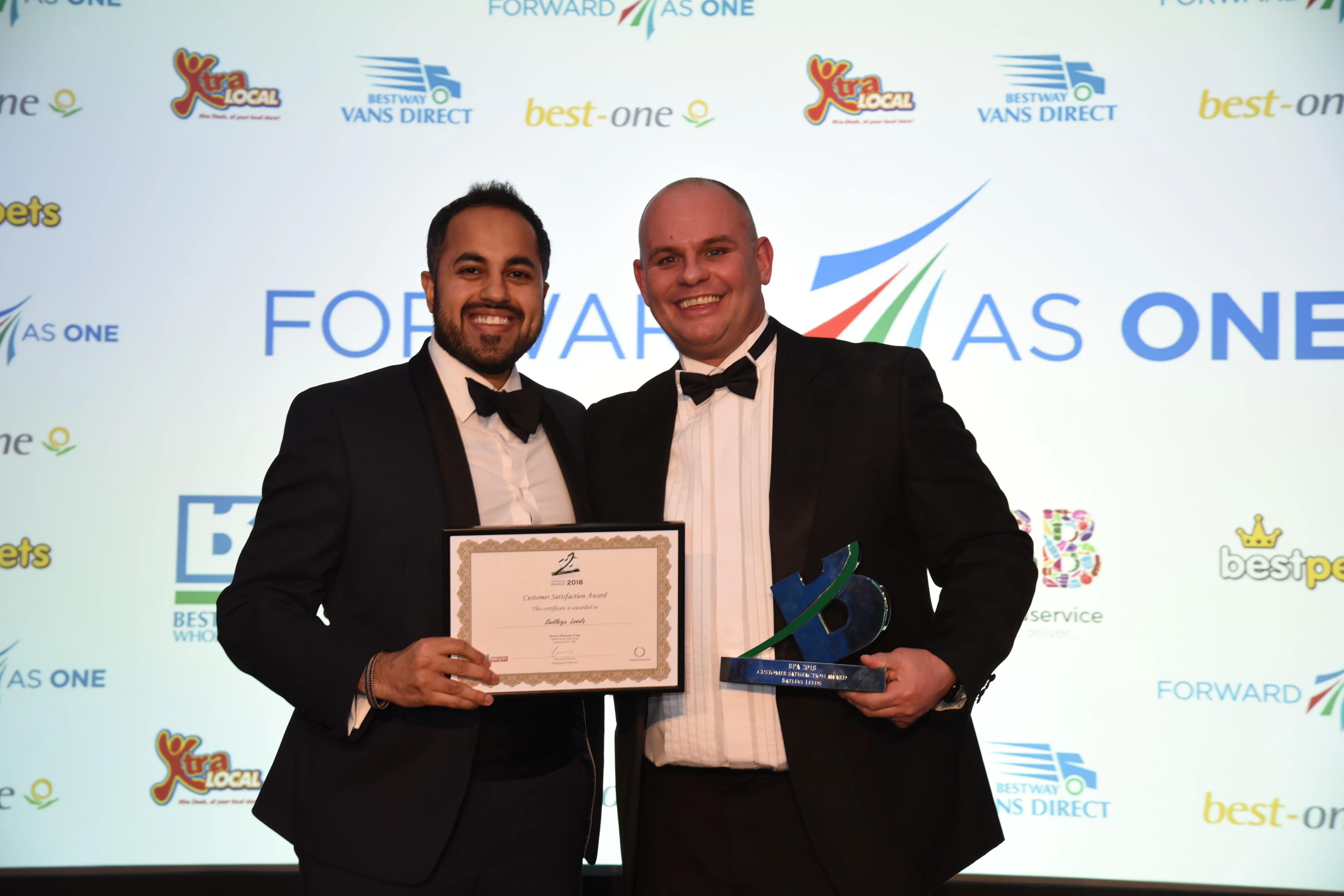 Left to right: Salih Sheikh, Head of Marketing, presents award to Jason Longstaff, General Manager, Batleys Leeds