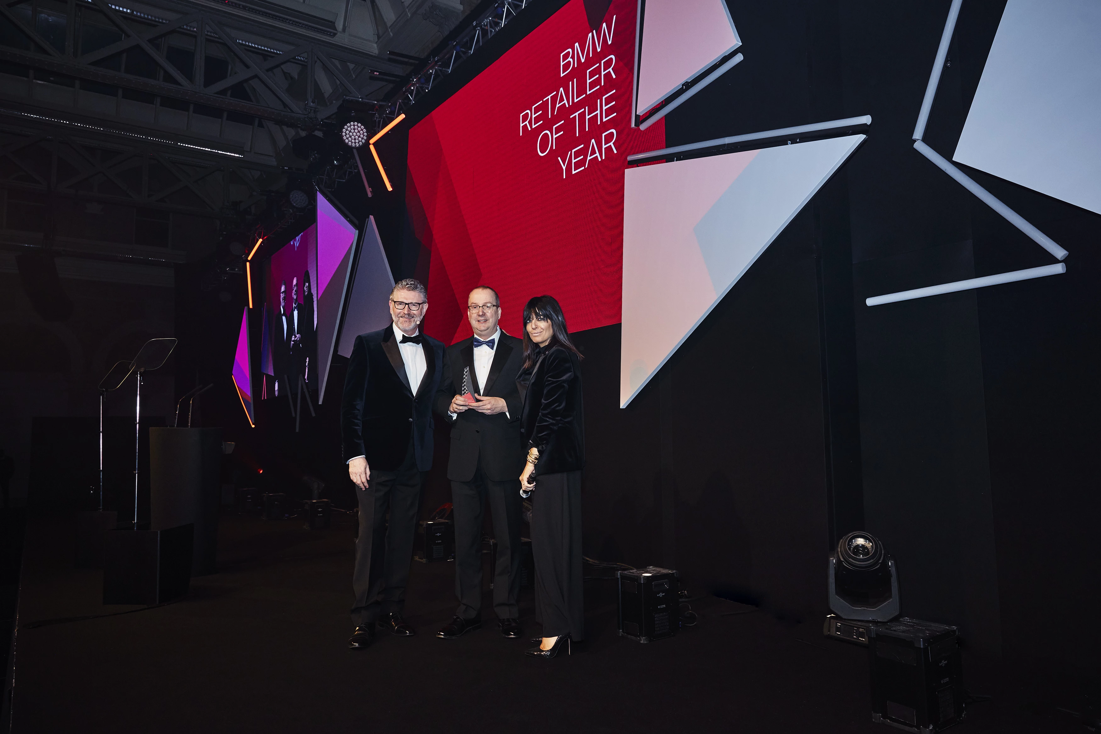 David Lewins, Lloyd Newcastle Head of Business pictured with presenter Claudia Winkleman and BMW Group UK Managing Director Graeme Grieve