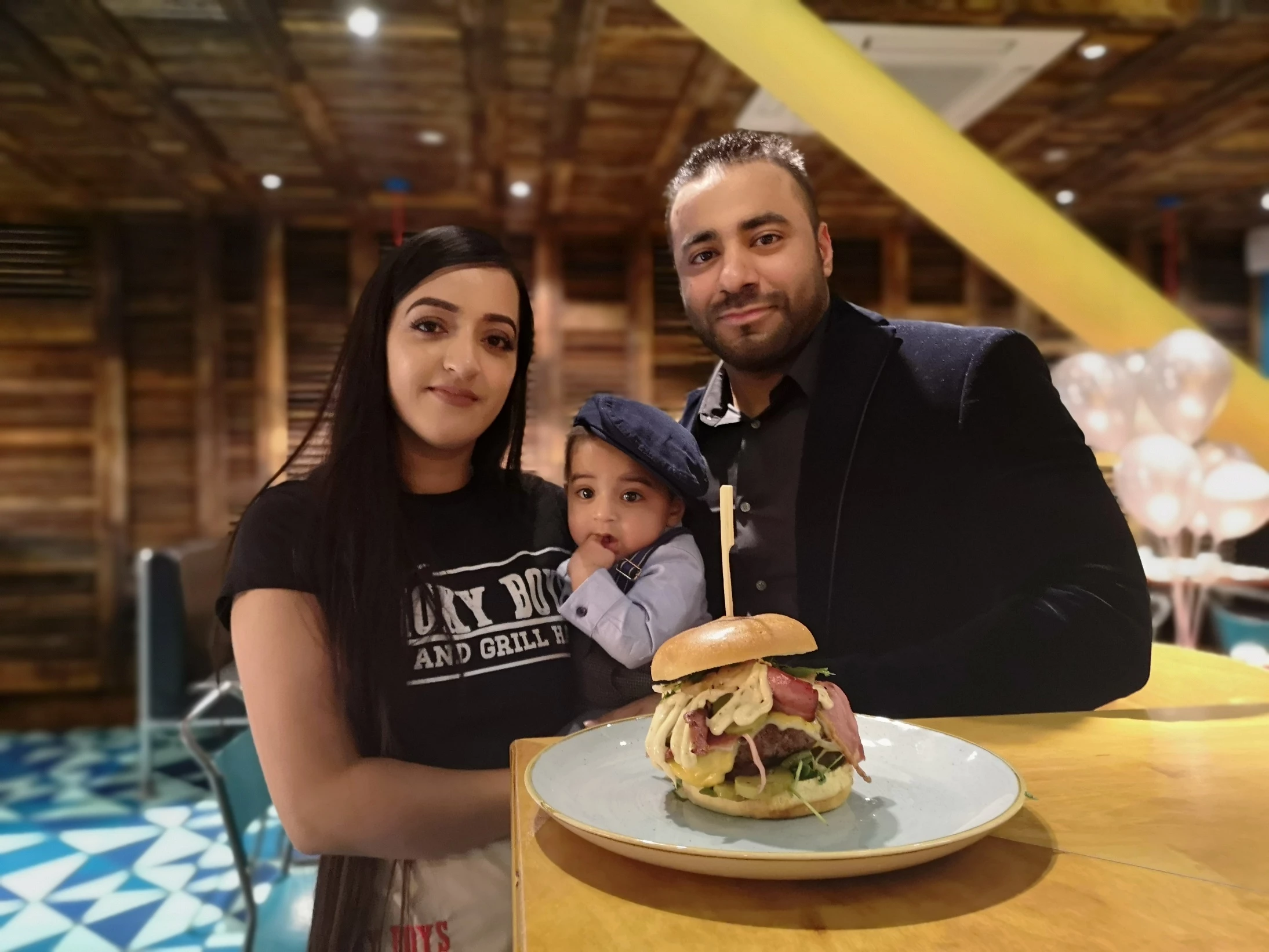 Siddra with young Husnain and Usman inside their restaurant