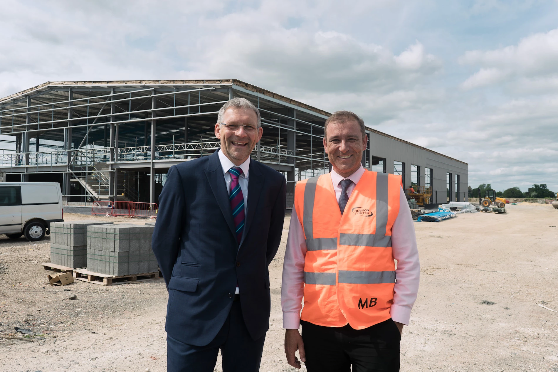 Ian Hodges, Managing Director of the Horncastle Group PLC and Mike Beal, Construction Director at Hobson and Porter, outside DHL’s new office and warehouse development on Ozone Business Park, Howden.