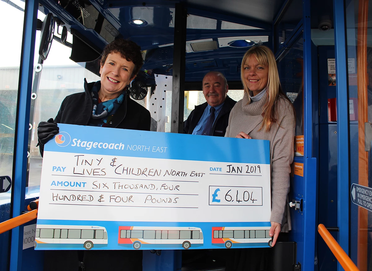 Walkergate (Newcastle) - Pauline Holt (CNE) and Louise Carroll (Tiny Lives) were presented with a cheque from bus driver Dave Kenney