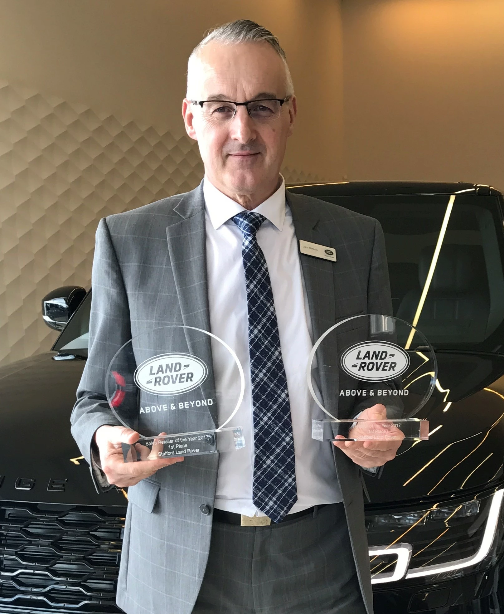 Stafford Land Rover, Head of Business, John NImbley with both Land Rover UK awards