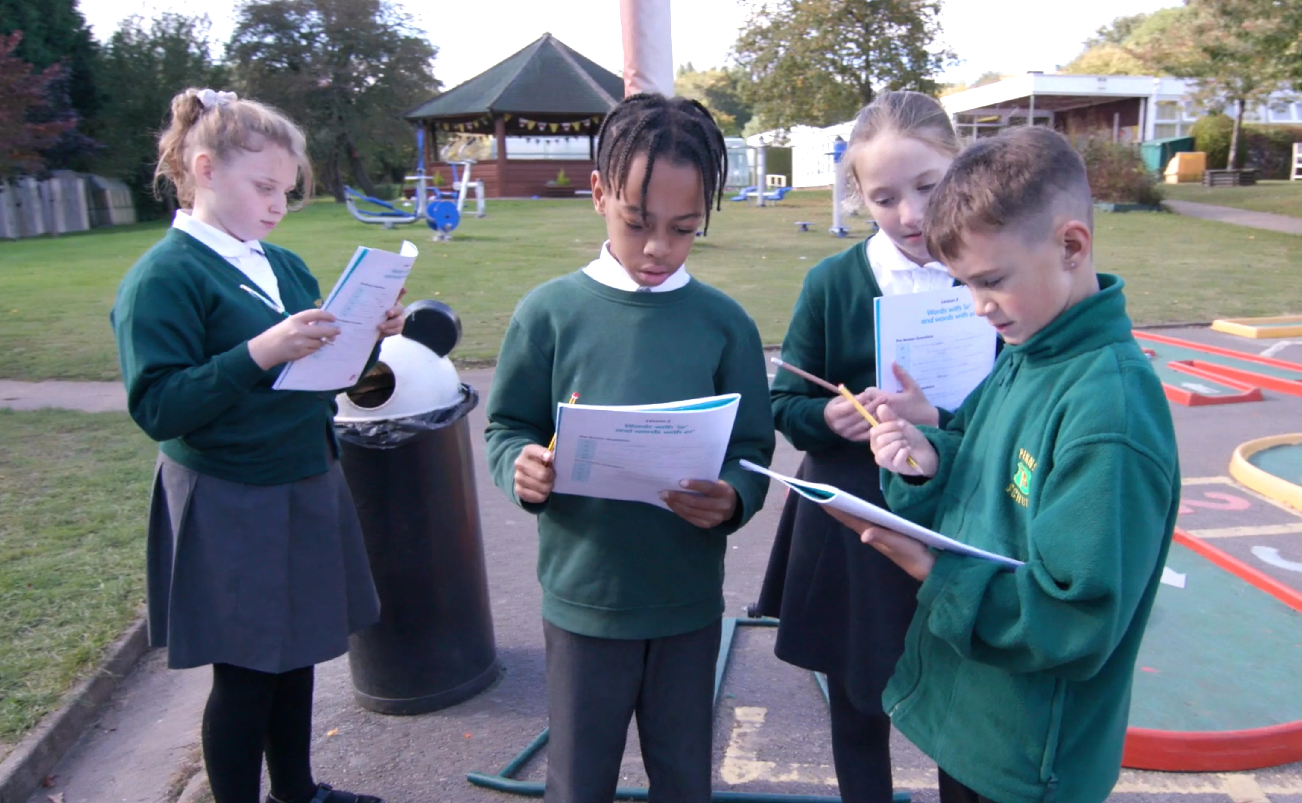 Pupils at Penns Hall Primary School in Sutton Coldfield complete English On The Move tasks outdoors
