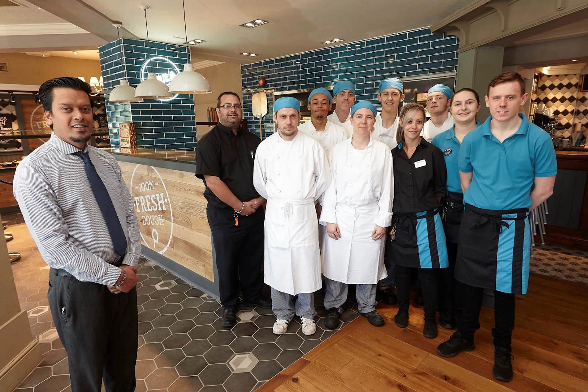 General Manager at the Wellington, Mayadeo Babooram (left), and his team welcome the pub’s reopening.