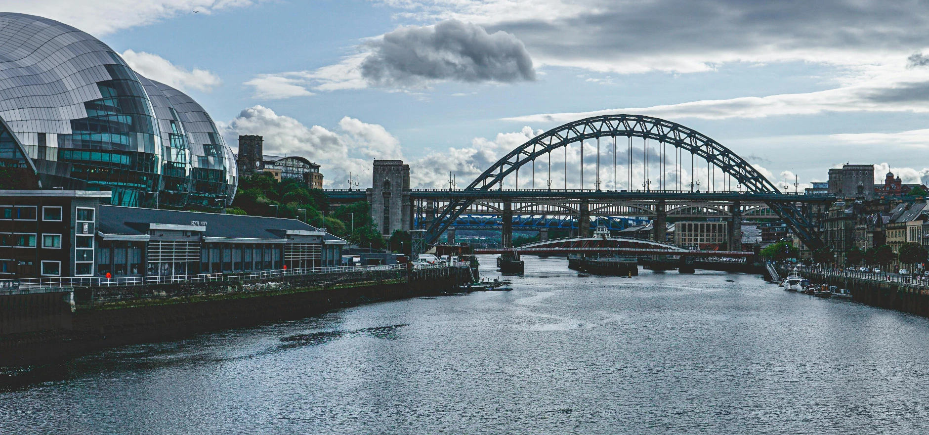 View of iconic bridges and contemporary architecture along the River Tyne in Newcastle.