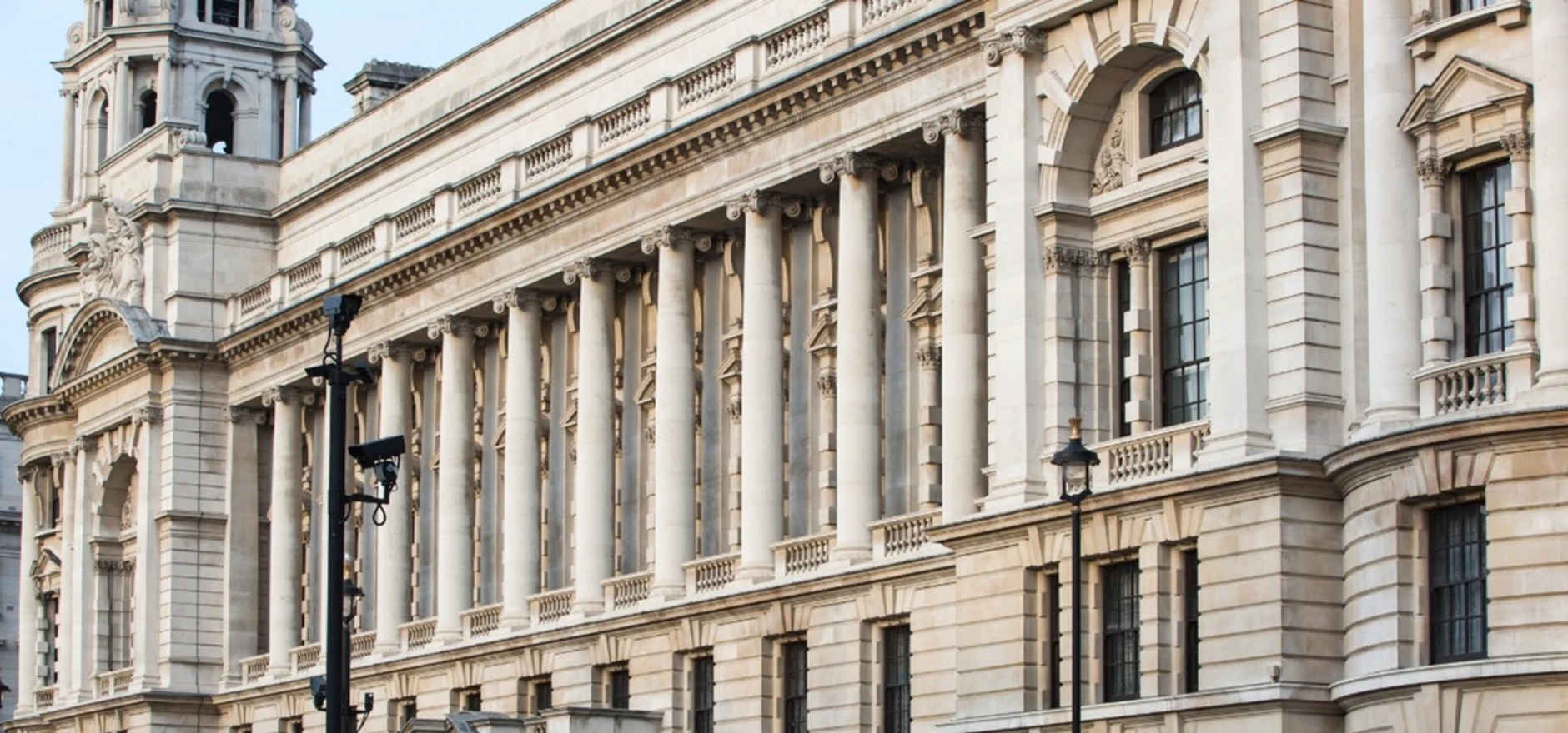 UK Treasury building symbolising government control over public funds, sparking debate on minority spending amid rising cost of living UK concerns