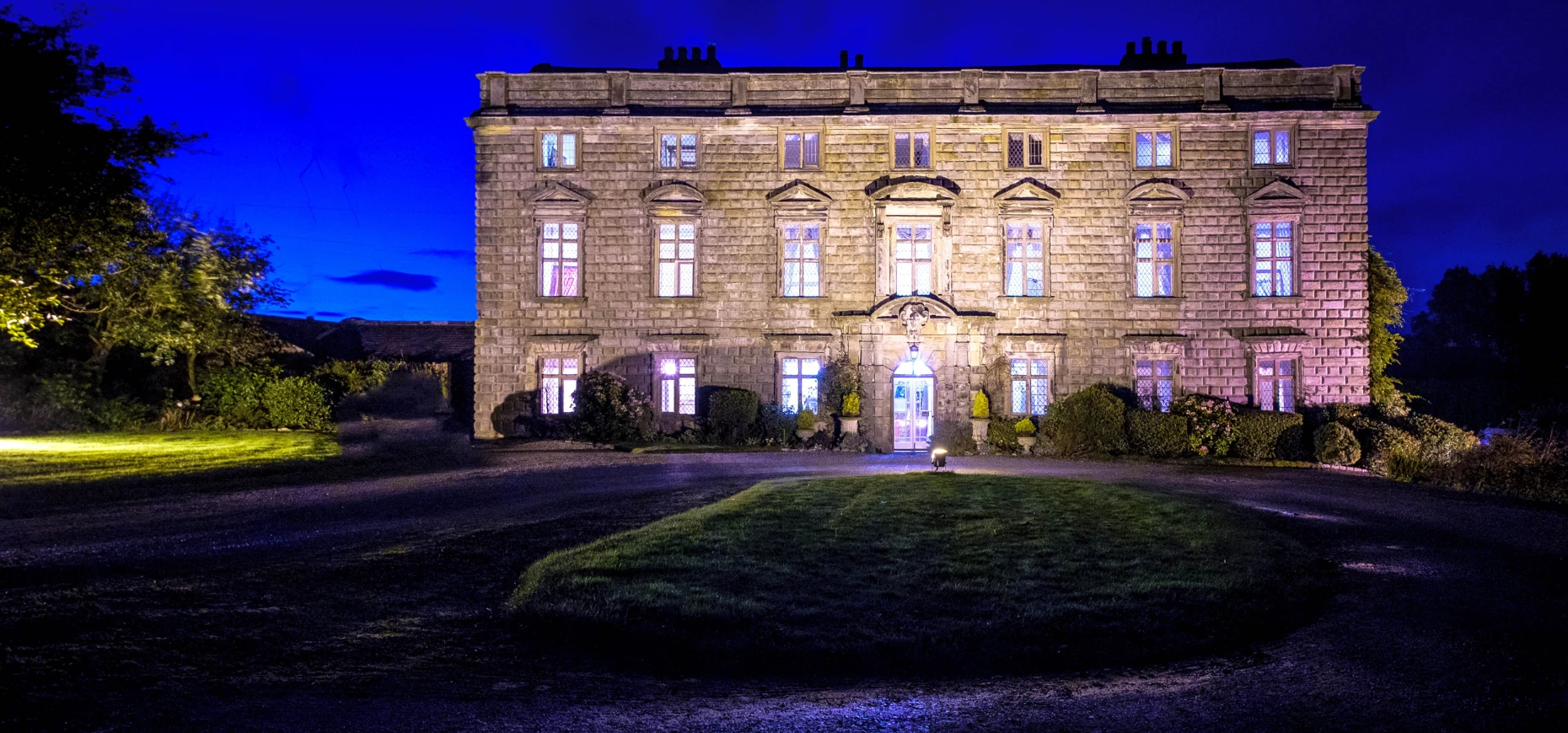A night-time exterior shot of the Cumbrian manor house, Moresby Hall.