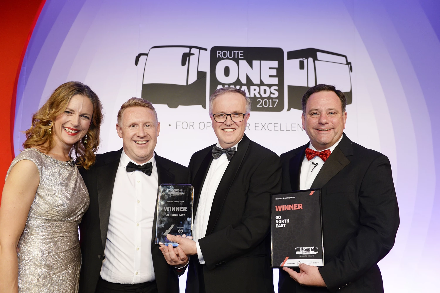 L-R: routeone Awards presenter Katie Derham, Go North East's Head of Engineering Colin Barnes, Freight Transport Association Chief Executive David Wells and routeone Editor Mel Holley