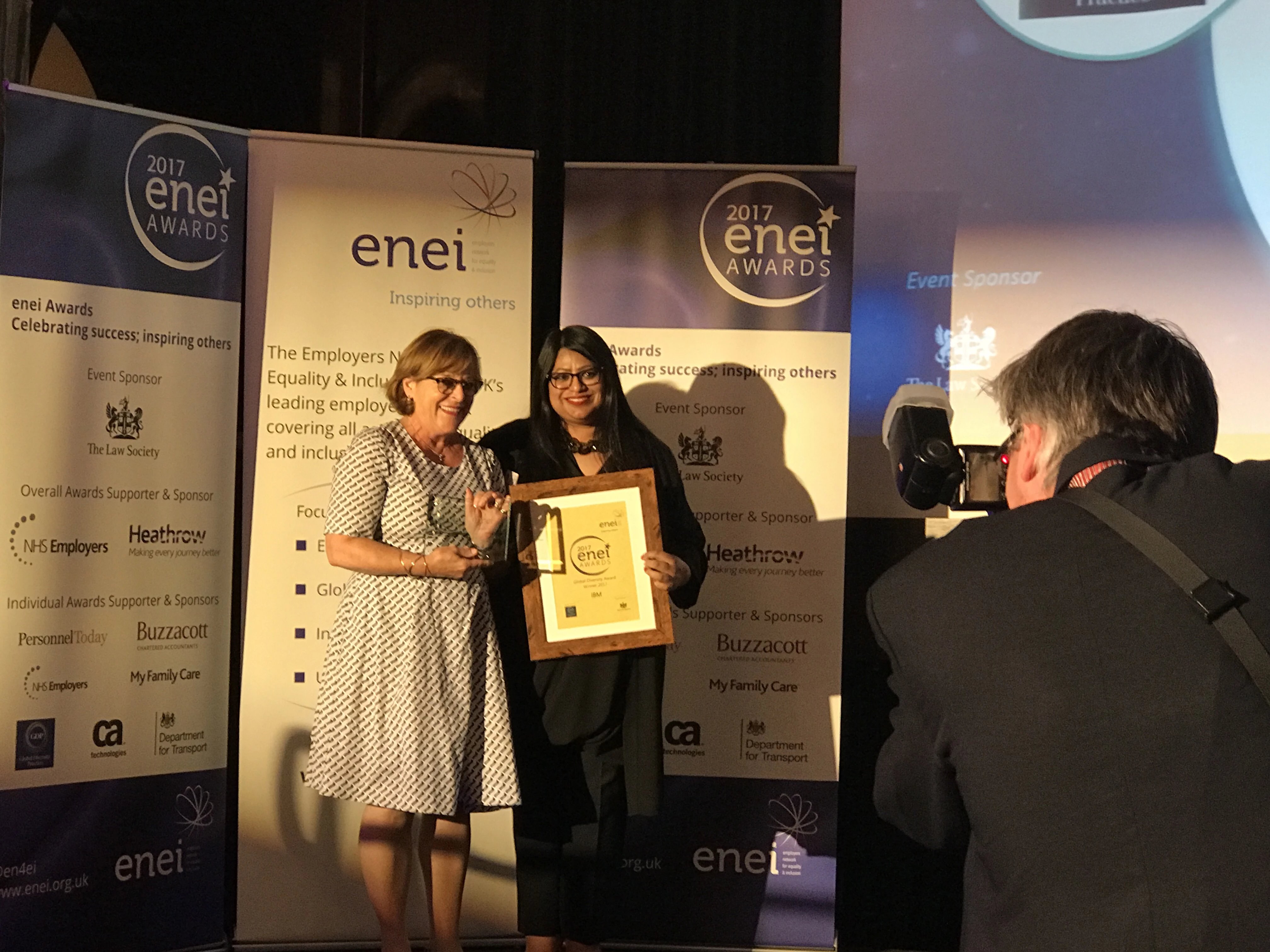 Deborah Richards accepts the enei award from Farrah Qureshi, CEO GDP